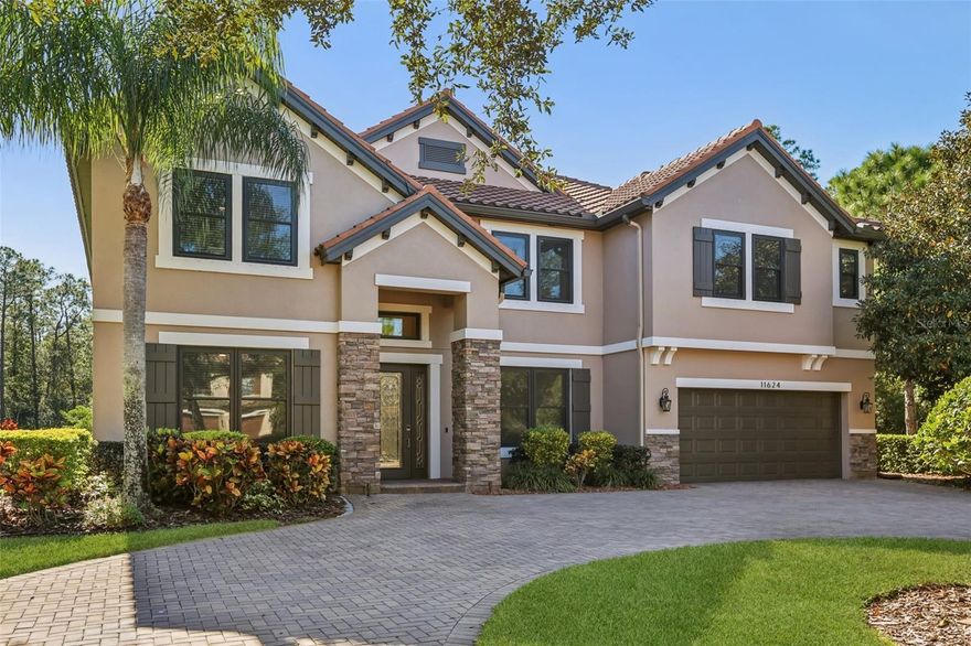 A rare find in the private, gated enclave of Calf Path Estates—an exclusive community of just eight homes tucked within scenic Highland Park. Set on a peaceful 1.03-acre conservation lot, this spacious 5,300 sq ft residence blends refined comfort with thoughtful upgrades throughout. Brick streets lead you to a stunning tile-roof home featuring 5 bedrooms, 5.5 baths, and a layout designed for everyday living and effortless entertaining. A saltwater pool with an internal cleaner, a large lanai, and a fully screened enclosure create the perfect outdoor retreat. Inside, the first floor centers around bright, open living spaces, tray ceilings, and a dedicated home office. The primary suite offers quiet separation with a generous spa-like bathroom and a custom walk-in closet. A guest suite with a private bath is also conveniently located downstairs. The kitchen delivers exceptional storage, a walk-in pantry, a coffee station, a gas cooktop, and stainless-steel appliances—ideal for gatherings of any size. A spacious laundry room is also located on the main level. Upstairs, an oversized bonus room provides endless flexibility for recreation, hobbies, or a secondary living space. You’ll also find a movie room/flex room, a dedicated craft room, and three additional bedrooms, two featuring their own ensuites. This home is built for long-term comfort and efficiency with new hurricane-rated windows, a Generac 22 kW whole-home generator, a tankless water heater, a water softener, and impressive energy performance. The three-car garage includes an EV charger for added convenience. Enjoy the perks of low HOA fees along with access to Highland Park’s highly desirable amenities—clubhouse, fitness center, community pool, parks, and more. Residents of Calf Path Estates also have exclusive use of the private community dock on the serene, non-motorized lake. From its peaceful setting and modern upgrades to its flexible living spaces and resort-style outdoor features, this home delivers the perfect blend of privacy, luxury, and everyday practicality. Call now and schedule your viewing today!