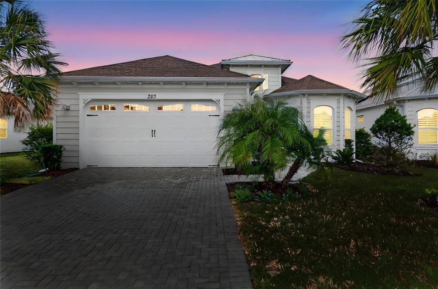 Welcome to paradise in Latitude Margaritaville! This upgraded Breeze model sits atop an oversized premium waterfront lot, offering refined comfort and relaxed living with over $35k in upgrades. The spacious kitchen is the heart of the home, featuring upgraded energy-saving stainless steel appliances, a gas range, under-cabinet lighting, and an enormous island accented with unique shiplap detailing — perfect for cooking and entertaining. Attention to detail abounds, including plantation shutters, recessed lighting and blown-in attic insulation for enhanced energy efficiency. There is also a paver driveway and an upgraded lanai with custom roll-down shades. Enjoy resort-style amenities, including a private beach club with transportation, sparkling pool and recreation, and an on-site restaurant.