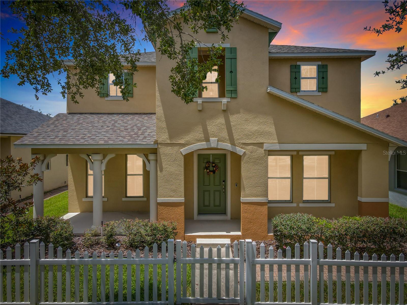 Welcome to 2463 Lacerta Drive, an immaculate 3-bedroom, 2.5-bath, 2,445 sq ft home nestled in the gated Avalon Lakes community, just minutes from downtown Avalon Park’s vibrant shops, dining, and community events. This two-story home boasts standout curb appeal with a white picket fence and manicured landscaping, leading into a bright, open interior filled with neutral finishes and natural light. The modern kitchen features white shaker cabinets, granite countertops, a mosaic tile backsplash, black appliances, and a breakfast bar that opens to the living and dining areas making it ideal for entertaining. Enjoy seamless indoor-outdoor living with a fully screened lanai offering privacy. Upstairs, the oversized primary suite includes dual walk-in closets and a spacious en suite bath with a soaking tub, double vanity, and separate shower. Two generously sized bedrooms, a full hallway bath, and a laundry room with built-ins complete the upper level. The roof was replaced just one year ago, and the A/C unit is only three years old, offering added peace of mind. Community amenities include a resort-style pool, cabanas, parks, playgrounds, and scenic walking trails. With top-rated schools, proximity to Waterford Lakes and UCF, and easy access to major highways, this home offers not only space and style but a lifestyle of convenience and community living. Don’t miss your chance to own in one of East Orlando’s most desirable neighborhoods, schedule your private showing today!