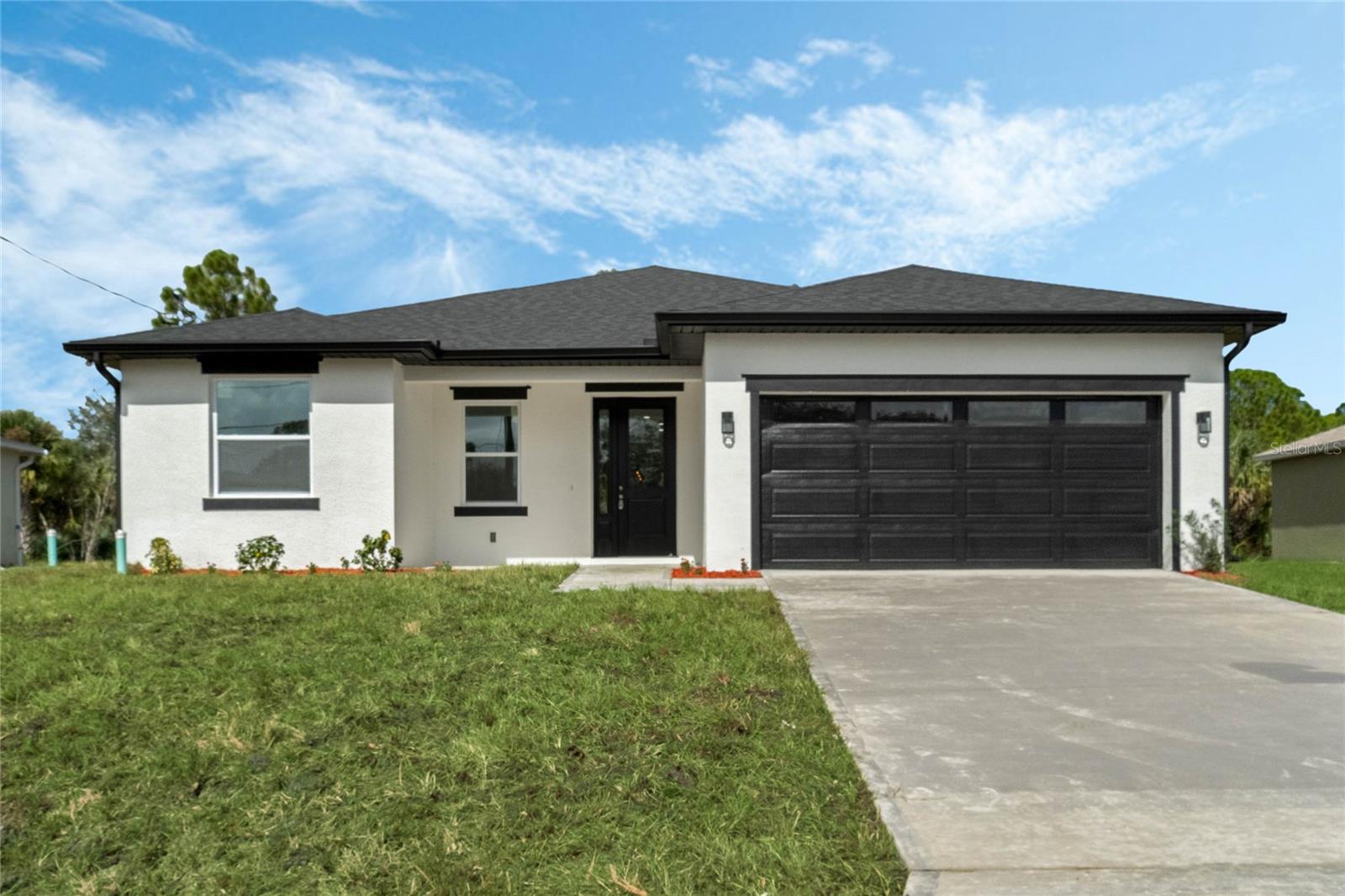 Presenting 521 Garbelmann Street SW—a beautifully crafted new 4-bedroom, 2-bathroom single-family home, perfectly situated in the peaceful community of Palm Bay, Florida. This 1,800-square-foot home embodies modern comfort and convenience, offering a spacious, open-concept layout designed to meet all your needs. The heart of the home is the expansive kitchen, featuring elegant floor-to-ceiling cabinetry, quartz countertops, and a generously sized island that serves as a central gathering space. High-quality finishes and thoughtful design make this kitchen both functional and stylish, ideal for casual meals or entertaining guests. The living area is equally inviting, enhanced by rustic wood-finish beams that add character and warmth to the space. The split floor plan ensures privacy, with bedrooms well-positioned for both comfort and quiet. Enjoy the peace of mind that comes with a brand-new construction, complete with a new roof, HVAC system, plumbing, and electrical—all crafted for longevity and energy efficiency. The two-car garage offers ample space for vehicles and storage, adding to the practicality of this home. Located in a quiet neighborhood with no HOA fees, this property offers the freedom to enjoy your home without restrictions. Just minutes from shopping, dining, and the stunning Florida coastline, this home combines the best of peaceful living with convenient access to local amenities. Major highways are close by, making commuting and travel a breeze, while nearby attractions and beaches provide endless options for relaxation and recreation.