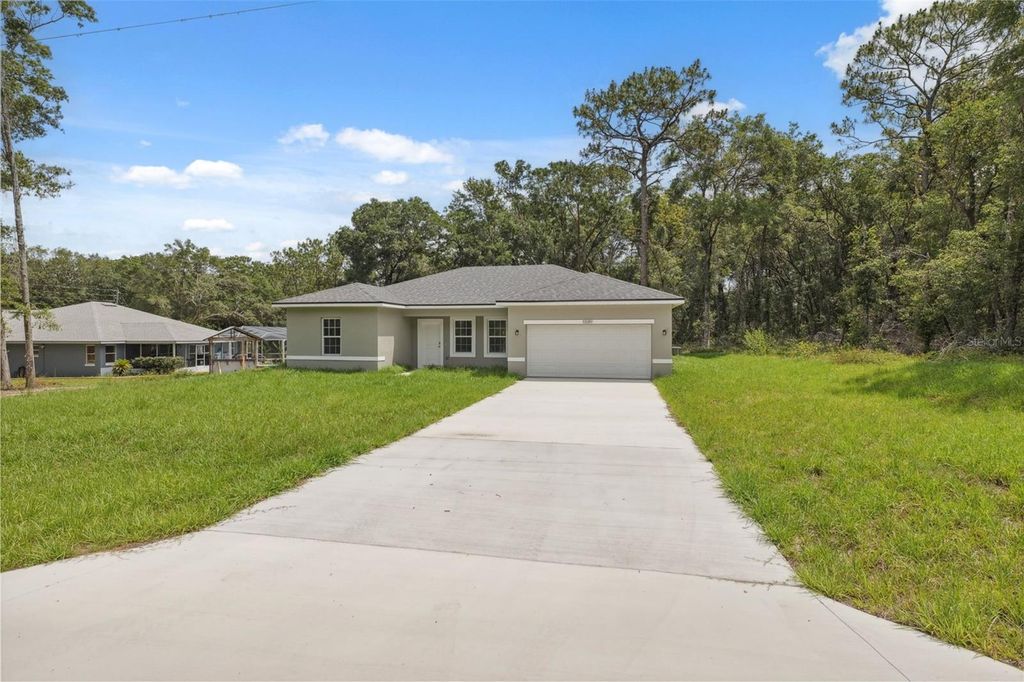 Photo of 10089 N Athenia Dr, Citrus Springs, FL 34434 (MLS # O6332724)