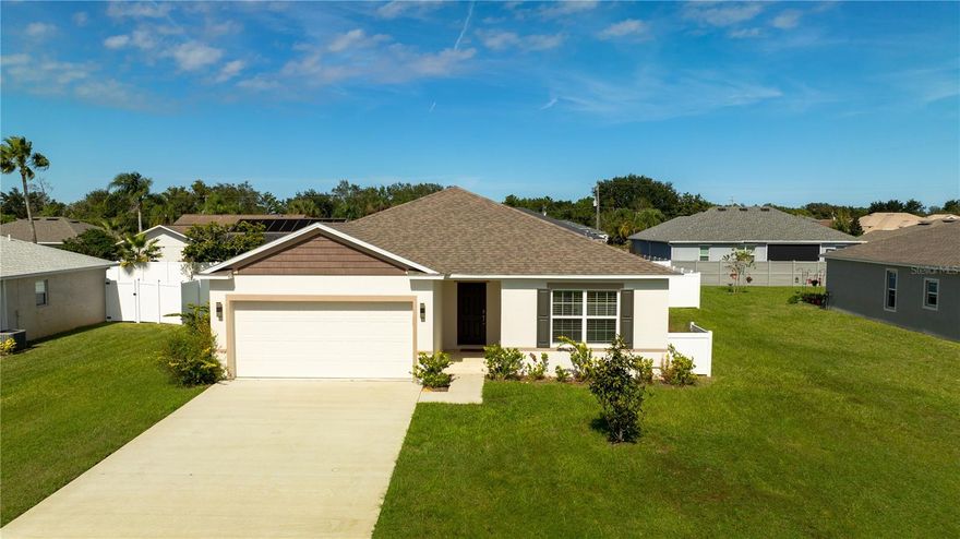 Welcome to this stunning 4 bedroom 2 bathroom home in the F Section of Palm Coast. Built in 2022 and offering 1,895 square feet, this beautifully maintained home features a modern open floor plan with ceramic tile throughout the main living areas and carpet in all bedrooms. The spacious kitchen showcases an oversized granite island and opens seamlessly to the dining and living spaces. The split bedroom layout provides privacy while the primary suite offers dual sinks and a luxurious walk in shower. Enjoy outdoor living on your open patio and fully fenced backyard, perfect for relaxing or entertaining. Lawn care is included so you can spend more time enjoying your home. Conveniently located near shops, dining, and entertainment with quick access to I-95. Schedule your tour today to experience all this home has to offer!