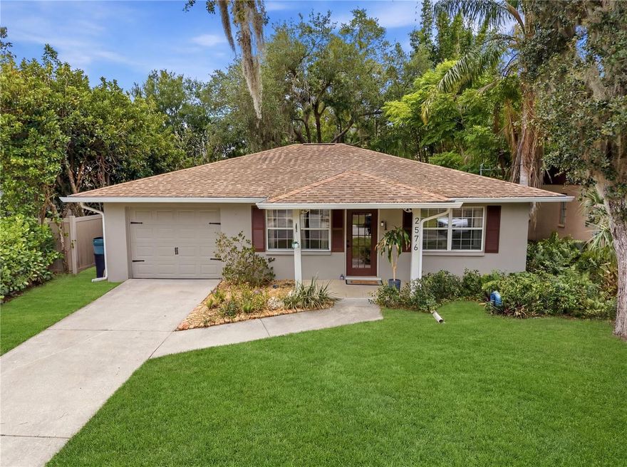Welcome to this beautiful Sarasota gem nestled on a quiet, tree-lined street in the desirable Orange Grove Park community. Offering 2 bedrooms, 2 full bathrooms, and 1,296 square feet of thoughtfully designed living space, this charming single-story home blends timeless character with modern comfort and Florida lifestyle appeal.

Step inside to discover an inviting open floor plan featuring sleek tile flooring, a soft contemporary color palette, abundant natural light, and stylish upgrades throughout. The spacious living and dining areas flow seamlessly into the well-appointed kitchen, creating the perfect space for entertaining or everyday living. French doors lead to a bright glass-enclosed Florida room, ideal for a home office, reading nook, fitness space, or year-round relaxation.

The private primary suite offers a peaceful retreat complete with an updated en suite bath featuring a granite-topped vanity and vessel sink. Outside, enjoy your own tropical oasis with an elevated deck, tiled patio, privacy fencing, and lush mature landscaping that creates a serene backyard setting perfect for morning coffee or evening gatherings.

Enjoy peace of mind with move-in ready condition, low-maintenance living, and the added freedom of no HOA restrictions.

Perfectly located just minutes from Downtown Sarasota, UTC shopping and dining, SRQ Airport, world renowned Gulf beaches including Siesta Key and Lido Key, parks, golf courses, and everyday conveniences. With easy access to I-75 and nearby arts, dining, and entertainment, this home offers the ideal combination of charm, location, and Florida lifestyle living.

Don’t miss this opportunity to own a beautifully maintained Sarasota home in a prime central location!