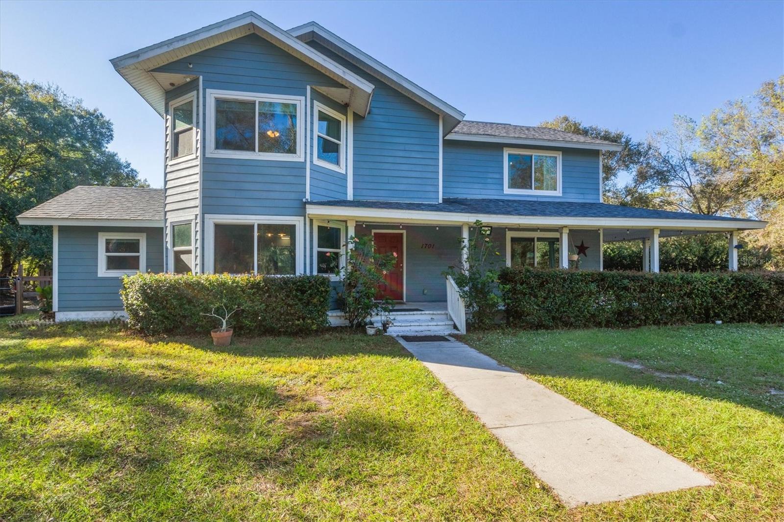 Buyers don’t wait; assumable 5.65% VA Loan! Tired of the traffic and congestion? Ready for the Florida farmhouse of your dreams? This stunning four-bedroom, two-and-a-half-bath is located on over 2.4 acres in tranquil and historic Arcadia. Pushed off the main road hidden between the southern oaks and pines, you'll be transported to your own country oasis in seconds. Taking your first steps toward the home, the large wrap-around porch greets you before entering through the front door into the foyer. Once in the foyer, you'll find your half-bath and an elegant fireplace bridging country with modern. To the right, you will find the main living space with beautiful shiplap walls and natural wood-like vinyl flooring. To the left, your spacious eat-in kitchen with an attached dining and breakfast bar will welcome you with natural light, beautiful white cabinetry, and stainless steel appliances. Tucked away in the kitchen is a spacious and separate laundry room, and off of the eat-in dining room, you will find a second living space or lounge area. All four bedrooms are located on the home's second floor, along with your guest bathroom. Your owner's suite is complete with an attached en-suite and is illuminated by the large bay windows that face out the front of your property. Enjoy comfort and security with hurricane-rated windows; this home stayed high and dry during the last hurricanes! Country living is only complete with a full range of outdoor amenities such as a large patio area, in-ground swimming pool, sheds, chicken coups, a large three-stall garage, and a spacious building, all yours to fulfill your country's dreams. If these amenities aren't what you're looking for, you have over 2 acres to make your dreams a reality! Take the southern route and drive beneath the canopy trees through the most beautiful neighborhood in Arcadia. This home’s location is not only gorgeous, it’s also convenient, less than ten minutes from shopping and dining located in downtown Arcadia off of State Road 70 and just over an hour from everything Florida's Gulf Coast offers! Don't let this one go!
