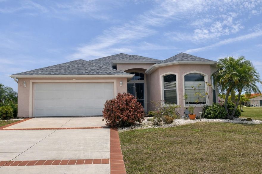 Beautiful 3-bedroom, 2 and 1/2 bath waterfront home with direct canal access and a private boat lift. Enjoy peaceful water views from the screened-in pool area, perfect for year-round Florida living. This well-maintained property features a 2022 roof, new air conditioning system, and a bright, open layout ideal for entertaining. The spacious kitchen and living areas flow seamlessly to the outdoor lanai and pool enclosure. Located in a quiet Port Charlotte neighborhood with convenient access to shopping, dining, and Gulf boating. All furniture will be included. Move-in ready and built for the coastal lifestyle.