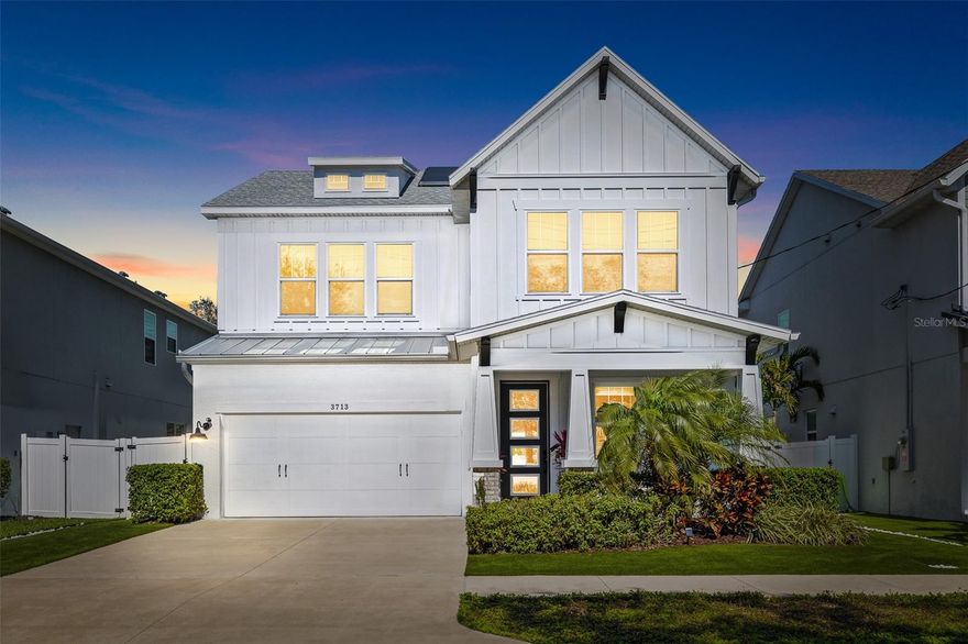 This IMMACULATE Virginia Park beauty is nestled in one of Tampa's most DESIREABLE & ACCESSIBLE neighborhoods. Steps from Corona Park, 2 landmark schools (Roosevelt Elementary and H.B. Plant High School), fantastic independent restaurants, ice cream shops, grocery stores, coffee shops and Bayshore Blvd Linear Park, this charmer checks off your entire "MUST HAVE" list! In the face of rising energy costs, this home provides the majority of its own energy via fully owned, Tesla Solar panels and 2 Tesla Power Walls that can reserve enough power to run the whole house for three days if power goes out. Gorgeous features await you inside this stunning home built in 2021 by David Weekley Homes. Work from home? Upon entering, you'll find a home office with French Doors and a shielded view of the comings and goings of your neighbors. Beyond the entrance lies an open, stunning kitchen with classically veined quartz counter tops, gleaming white shaker cabinetry reaching up to the 10'ceilings and trimmed out with CROWN MOLDING, stainless steel appliances, a FARM SINK with touchless extendable spray faucet, tri-vection ovens, huge island/breakfast bar, and a clever bit of storage that will be revealed to the next owner upon request.  The Dining space offers a built-in buffet including a wine/beverage refrigerator and leads to the inviting, large Living Room overlooking the covered lanai plumbed for water, gas, electric and co-ax for t.v. The Owner's FIRST FLOOR PRIMARY BEDROOM and Bath are stunning! The bedroom has tray ceilings, ample space and a beautiful view of the backyard. The bath has a half-walled and glass WALK-IN RAIN-SHOWER, Double sinks, Quartz countertops, private water closet, and a SPACIOUS WALK-IN CLOSET. The second-floor features 4 BEDROOMS, (two include their own private bathrooms) configured in a split plan layout separated by a large bonus/flex room/family room, a media room, 1 Hall Bath and a laundry room. Now for the stuff that makes your life easy - this house has 2 A/C's with UV Lights to disinfect the air by killing germs and viruses at the source, and "smart" filters that alert you to change them when spent - both units have been serviced semi-annually to ensure peak performance. Like the idea of tankless water heaters? Good! This home has 2 of them, one to service each floor. The builder installed hurricane-rated, high impact, insulated windows throughout, and this home's only owner paid to have aftermarket tinting added to all windows to introduce privacy and further energy savings. Finally, if you're still reading this, when you see this home take a look at this amazing garage that has features like epoxied floors, insulated and hurricane-rated Garage door and automatic opener, above door storage shelves, a port for a portable A/C unit, and outlets for your EV's. See? I told you it has it all!