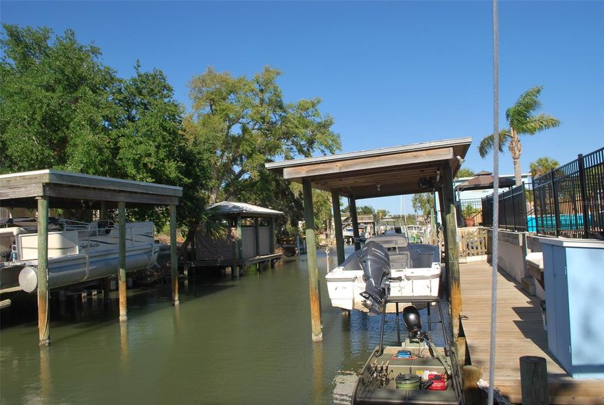 LAST CHANCE TO OWN WATERFRONT PROPERTY AS INVENTORY IS BEING DEPLETED! PRICED TO SELL QUICKLY!!!

 WATERFRONT LIFE IS GOOD! YOUR OPPORTUNITY TO OWN ON THE WATER WITH A BOAT HOUSE IS RIGHT HERE.  FULL-TIME OR WEEKEND GETAWAY THIS COMFORTABLE 3 BEDROOM TWO BATH SPLIT PLAN HOME WILL PLEASE EVERYONE. MAINTENANCE FREE YARD, SCREENED PORCH WITH ACCESS FROM MASTER BEDROOM & LIVING ROOM.  OPEN FLOOR PLAN WORKS GREAT FOR ENTERTAINING. HAVE YOUR BOAT RIGHT THERE FOR EARLY MORNING FISHING OR EVENINGS ON THE WATER. PRICED REDUCED TO SELL!! ;Water: City