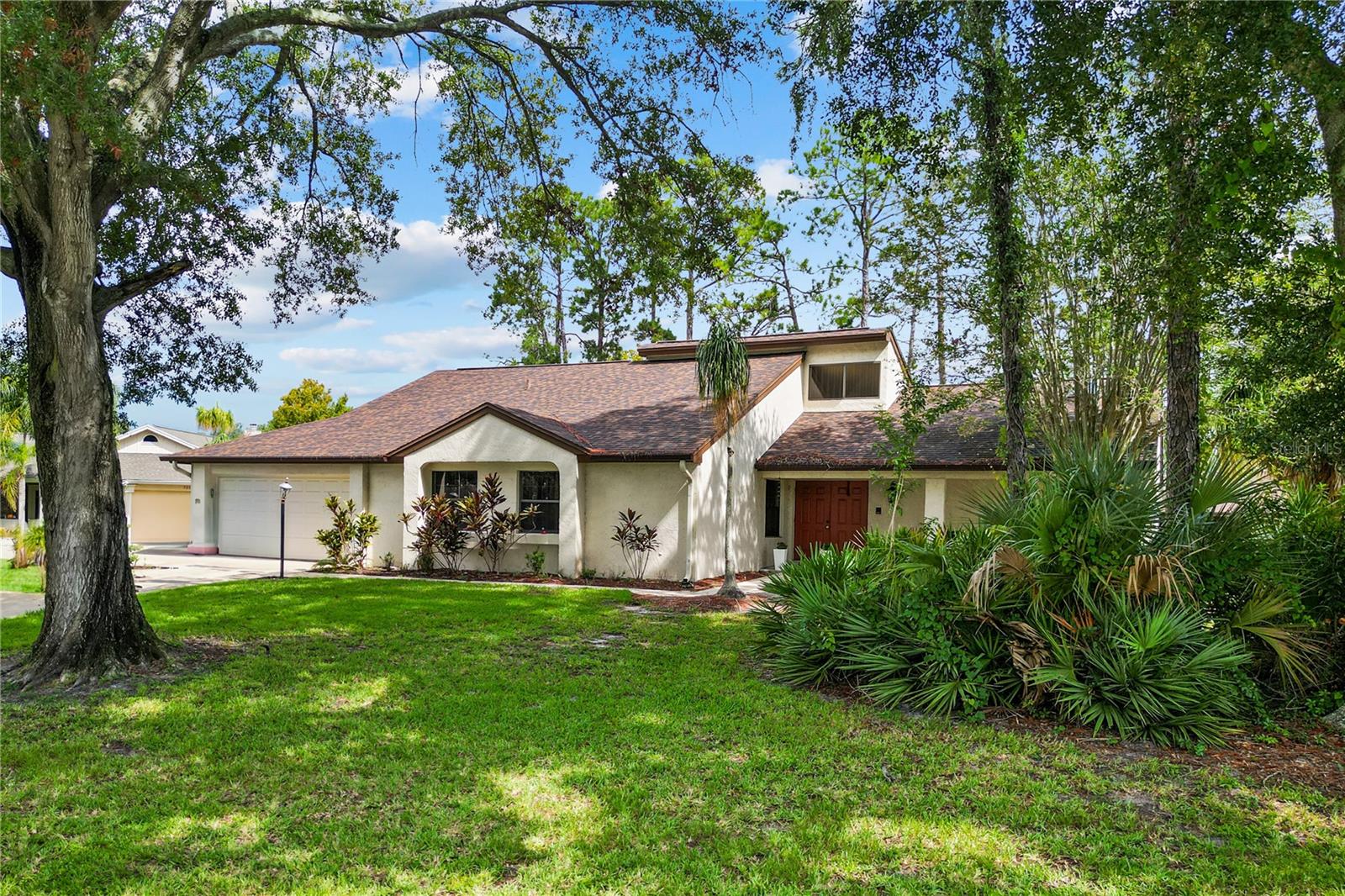 Welcome to Orange Tree in the Heart of Dr. Phillips. Location, lifestyle, and opportunity all come together in this 3-bedroom, 2-bath home with a bonus flex space in the highly sought-after Orange Tree community. Perfectly tucked away on a cul-de-sac and set on one of the largest lots in the neighborhood, this property offers both privacy and potential. Step through the double entry doors into a spacious formal living room, complete with a striking brick fireplace and natural light pouring in. A formal dining area with sliders leads to the oversized backyard—an ideal setting for entertaining or simply enjoying Florida’s sunshine. The split floorplan gives the primary suite its own wing, featuring a generous en-suite bath and walk-in closet. The kitchen opens seamlessly to the family room and dining nook, creating a comfortable flow for everyday living. This home is ready for a fresh new chapter—bring your design ideas and make it your own.
With a newer roof (2019) and HVAC (2021), the essentials are already in place, making it that much easier to focus on creating the home you’ve envisioned. Living in Orange Tree means more than just a home—it’s a lifestyle. Enjoy resort-style amenities including a private golf course, tennis courts, basketball courts, playgrounds, pool, and golf-cart-friendly streets perfect for walks with the dog. All of this in a gated community just minutes from everything Orlando has to offer, like Universal Orlando Resort (close enough to catch the fireworks!), and the acclaimed Restaurant Row on Sand Lake Road featuring favorites like Sixty Vines, Eddie V’s, Rocco’s Tacos, Ocean Prime, Seasons 52, and more. Nearly every grocer you can imagine is within two miles—Publix, Trader Joe’s, Sprouts, Whole Foods, and Wild Fork are all at your fingertips. Very close proximity to top-rated schools: Dr. Phillips Elementary, Southwest Middle, and Dr. Phillips High School. With quick access to I-4, you’re connected to anywhere you need to go in Central Florida. If you’re looking for space, location, and the chance to create your dream home in one of Orlando’s most established communities, this is it.