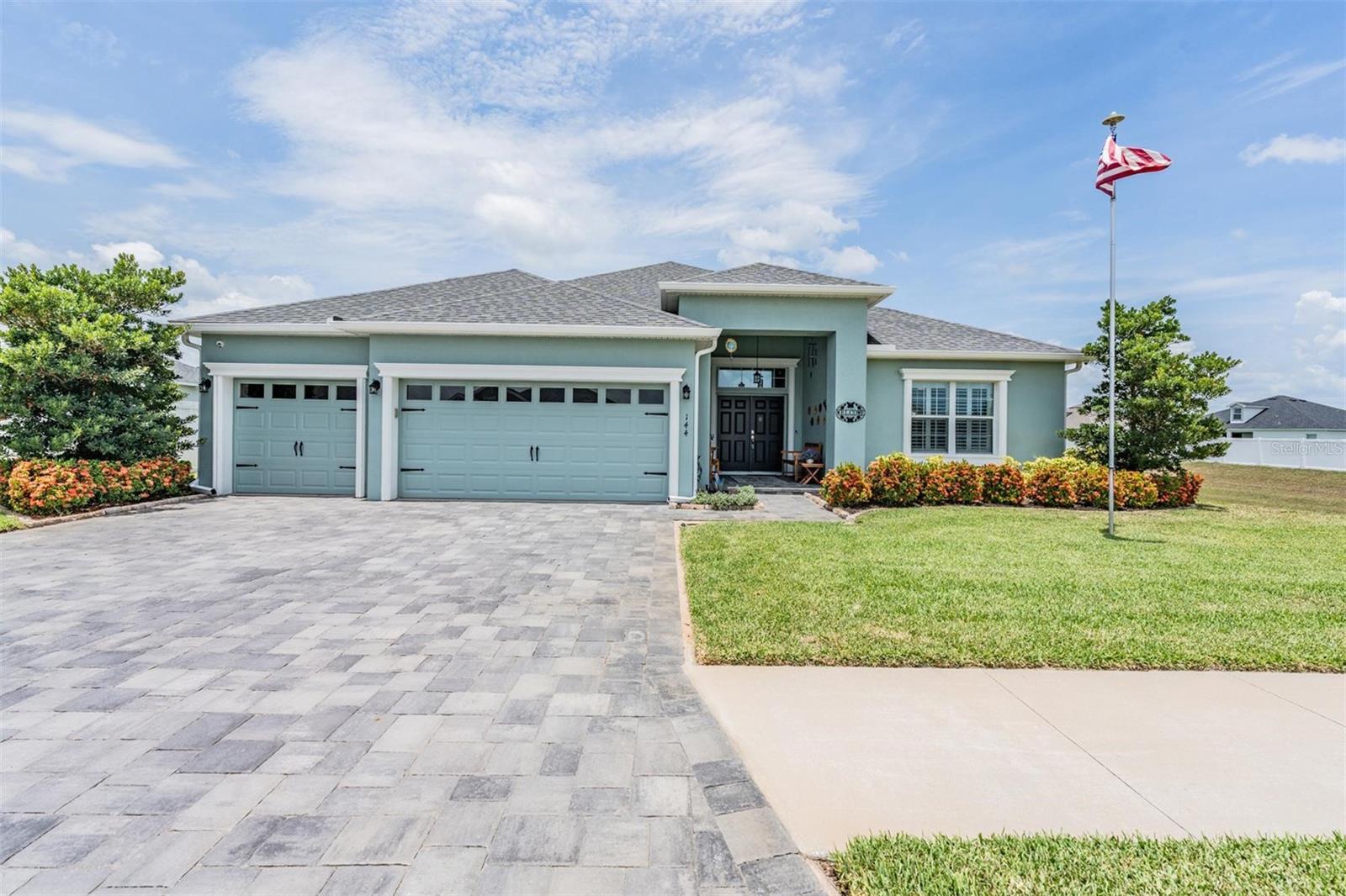 Welcome to Juliana Village of Auburndale, a gated Highland Homes community with private ambiance and beautiful, open conservation areas. This 2019 built home features 5 bedrooms, 3 bathrooms, an office, and luxurious features throughout. Set on a beautifully landscaped lot with Florida-friendly plantings, a paver driveway, and stunning conservation views, this property boasts impressive curb appeal. A grand double-door entry welcomes you into a light filled interior with luxury vinyl plank flooring in the main living areas, high ceilings, and a spacious, split-bedroom layout perfect for both everyday living and entertaining. The formal dining area flows seamlessly into the expansive great room, creating an open and inviting atmosphere. The well appointed kitchen features Corian countertops, stainless steel appliances, a tasteful backsplash, ample cabinetry, a pantry, and a breakfast bar for casual meals. Each bedroom offers generous space, while the primary suite stands out with its massive walk-in closet and private, ensuite bathroom complete with a soaking tub, walk-in shower, and dual sink vanity. At the back of the home is an enclosed and screened-in patio with ceiling fans for year-round enjoyment, and an adjacent screened patio housing a Hot Springs salt water spa. The fully fenced yard also features a Tuff Shed with electricity, providing additional workspace or storage. Juliana Village is located between Lake Juliana and Lake Mattie, with the Lake Juliana boat ramp just 0.2 miles away. You'll also have convenient access to I-4 enabling easy commuting to Orlando, Tampa, and Lakeland. Don’t let this stunning property pass you by, schedule a private tour today.