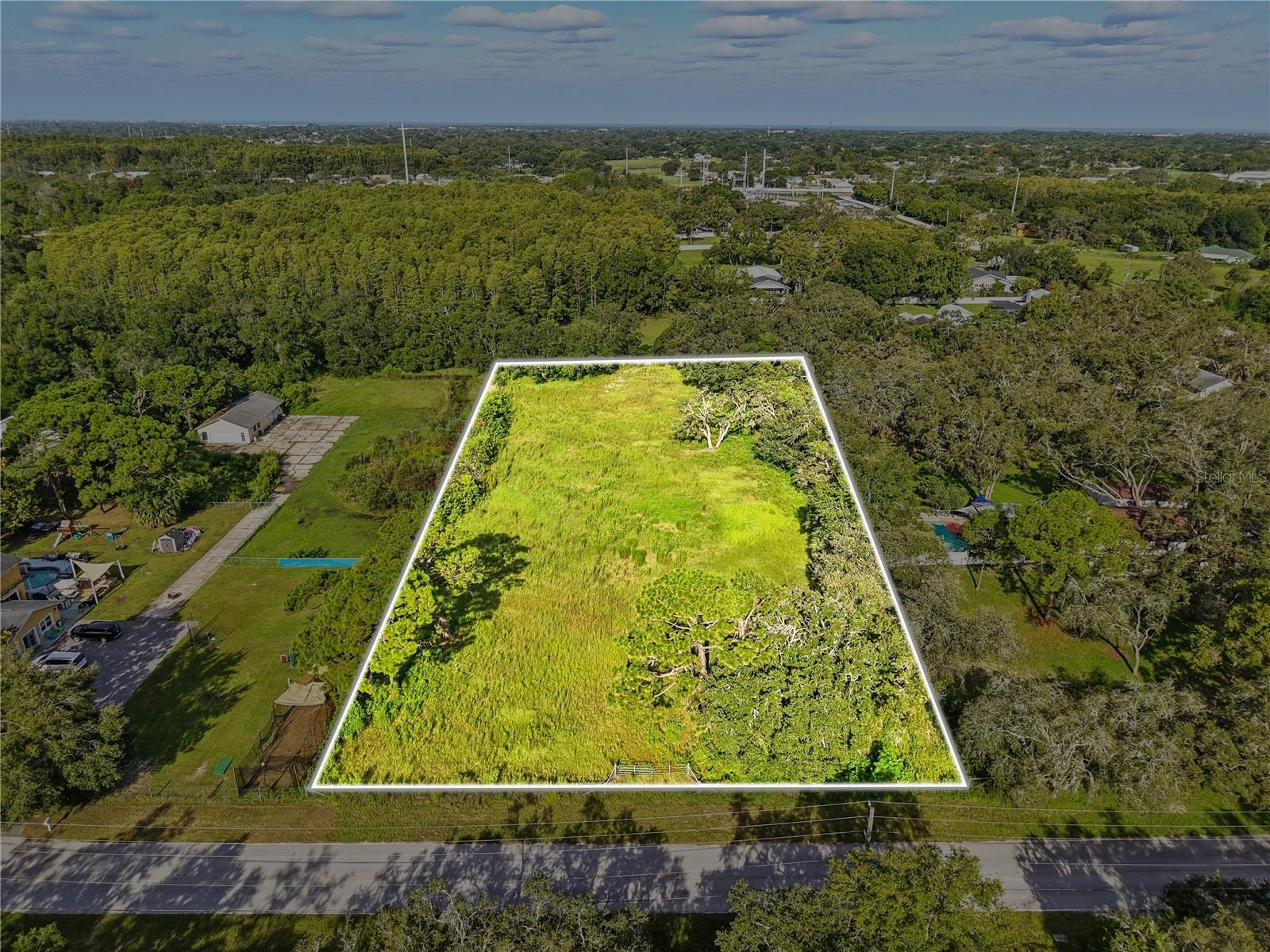 Discover the perfect opportunity to build your dream home on this spacious 2-acre vacant lot in the Osceola Heights community of New Port Richey. This mostly cleared parcel is fully fenced and ready for your vision, offering ample space for a custom residence, outdoor living, and room for your hobbies. Zoned for residential use, the property sits in a horse-friendly community, making it an excellent choice for those looking to enjoy a more rural lifestyle while still being close to everyday conveniences. With the majority of trees already cleared, the land provides a versatile canvas for construction and landscaping. Please note there are no utilities currently on or underground, giving you the freedom to design infrastructure to your preference. The location is hard to beat, just minutes from Little Road, where you’ll find a wide variety of dining options, shopping centers, and everyday essentials. The property is also close to schools, making it a convenient choice for families. If you’ve been searching for a quiet, private setting with the flexibility to create your ideal home while staying close to modern conveniences, this New Port Richey lot offers the best of both worlds.