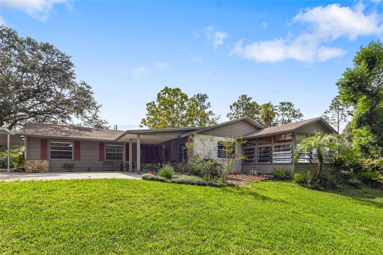 RARE Winter Garden Opportunity — Over 2.5 Acres! Welcome to your own private retreat in the heart of Winter Garden's most exciting growth corridor. Whether you're envisioning a peaceful country lifestyle or planning your next luxury estate, this property offers endless opportunities. Nestled behind a private gate and framed by a breathtaking canopy of mature trees, the entrance opens to a driveway leading to the home, completely surrounded by lush, usable land. The single-story well-maintained pool home offers over 2,500 square feet of living space. Originally built in 1982, the home features original hardwood floors in most of the living areas, a well-equipped kitchen with quartz countertops, and spacious living areas centered around a beautiful stacked-stone, wood-burning fireplace. All three bedrooms are generously sized, with two cocated at the rear of the home—one offering direct access to the pool area. An added 400-square-foot bonus room at the front of the home provides versatile space for your needs. Just off the main living area, double French doors lead to a charming Florida room—perfect for relaxing or entertaining family and friends. Step outside to your private oasis: a large custom-designed pool surrounded by nature. With agriculture zoning and all 2.57 acres high-and-dry, you have the freedom to build your custom dream home, create a nursery, hobby farm, establish a small agricultural business, or simply enjoy wide-open space and privacy. Enjoy peaceful evenings under the stars in your own slice of paradise. Located just minutes from Hamlin Town Center, Horizon West, and a short drive to Disney, this is a rare blend of rural serenity and suburban convenience.