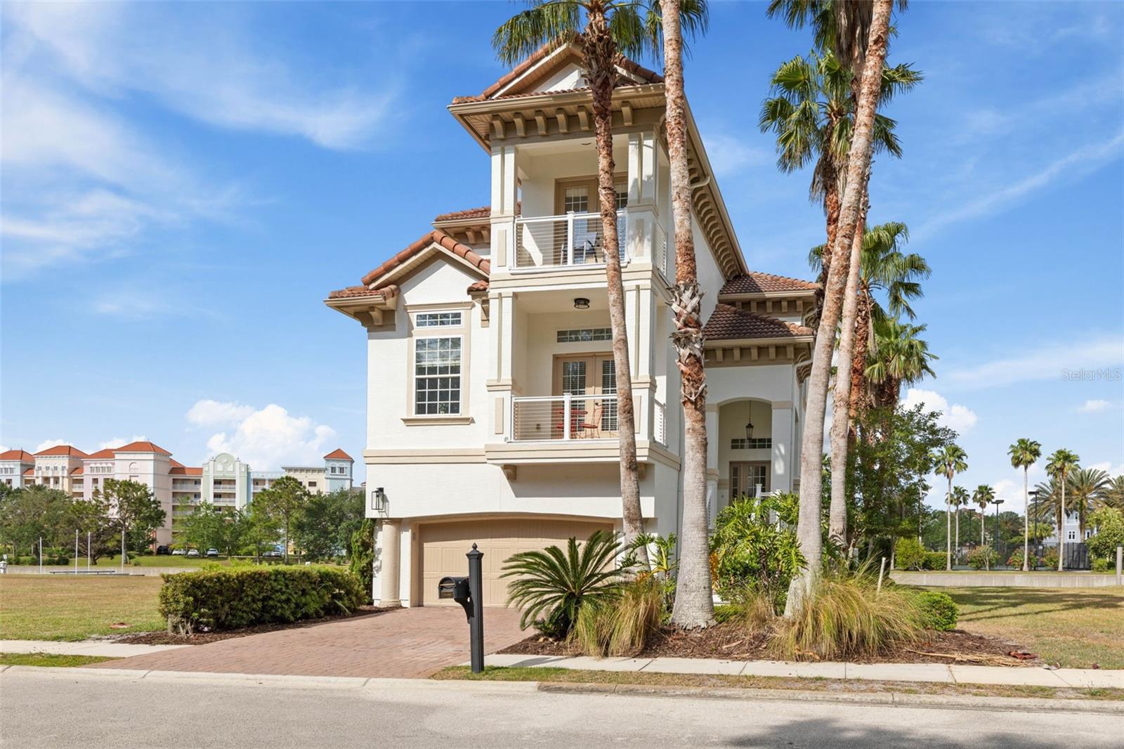 Stunning 4-bedroom, 4-bathroom waterfront home located in the exclusive gated community of Yacht Harbor Village. This residence offers direct Intracoastal Waterway access with a private floating dock accommodating a boat up to 32 feet, plus a lift for a jet ski or wave runner. Recent updates include a full exterior repaint, new impact windows and sliders at the rear, and modern coastal railings. Enjoy outdoor living with a private pool, summer kitchen, and multiple balconies featuring beautiful water views and sunsets. Inside, soaring ceilings and an open-concept layout fill the living space with natural light. The updated kitchen features a large center island with a wine refrigerator, kettle faucet, and premium Italian range. The spacious floor plan offers over 3,300 square feet, including two primary suites, two additional bedrooms, a family/game room, and the convenience of an elevator. Additional highlights include two brand-new AC units and a new pool heater, providing comfort and peace of mind. This home combines luxury, functionality, and an exceptional waterfront lifestyle.