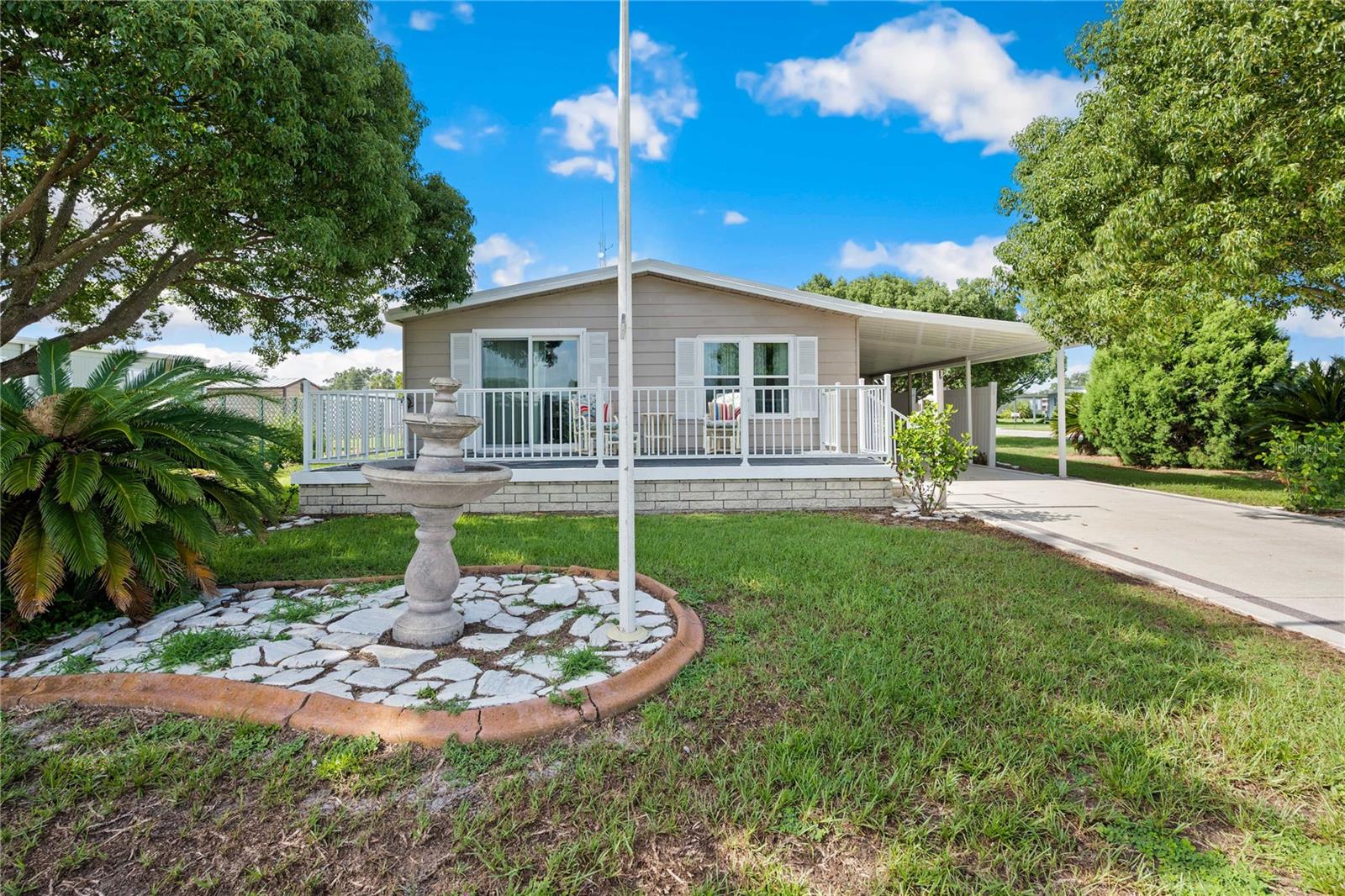 Welcome to 36732 Beth Avenue in the desirable 55+ golf community of Betmar Acres, where you own your land and enjoy low fees with no lot rent. This spacious 2-bedroom, 2-bath home is ideally situated on a large corner lot and features a bright, open living room at the front of the home with vaulted ceilings and plenty of space to entertain. The living room flows into the formal dining room, complete with a built-in china hutch, which leads to a well-appointed kitchen with upgraded, matching stainless steel appliances, an eat-in breakfast bar, and loads of cabinet storage. The primary bedroom is privately located at the back of the home and easily accommodates a king-size bed, offers a walk-in closet, and includes an ensuite bath with an updated vanity and large step-in shower with glass sliding door. The guest bedroom is generously sized and perfect for visitors, with space for a queen-size bed and a good-sized closet. The nearby guest bath features a luxurious jetted walk-in tub with a shower attachment. Throughout the interior, you’ll find durable laminate wood floors and updated double-pane windows for energy efficiency. The A/C was replaced in 2024, and a new metal roof was installed in 2025, offering peace of mind for years to come. The exterior of the home includes a huge open-air patio (24 X 10)—an inviting space to relax with your morning coffee or greet friendly neighbors. With its generous size, this area could easily be transformed into a charming screen room or even enclosed for additional living space. Out back, you’ll find a large workshop with laundry area, an additional storage building, and a golf cart garage with a roll-up door, offering ideal space for hobbies, a man cave, or even an artist’s studio. And, you will also love that Betmar Acres is one of Zephyrhills’ most popular and active 55+ communities and offers a wide range of amenities including three clubhouses, three private golf courses, two swimming pools, hot tubs, tennis and pickleball courts, shuffleboard, walking trails, bocce ball, billiards, card rooms, live music, dances, hobby groups, and social events throughout the year. Located close to shopping, restaurants, medical facilities, and downtown Zephyrhills, this home truly offers the best of Florida living. Schedule your private tour today and come see why so many love calling Betmar home!
