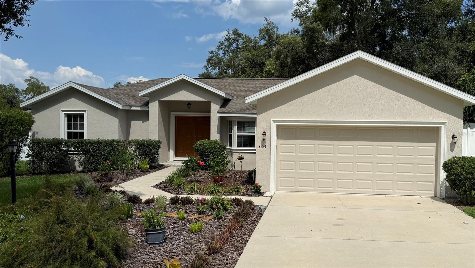Welcome to this beautifully maintained 3-bedroom, 2-bath home in the desirable Stonewood Estates Community of Lady Lake.
Built in 2017, this home features a bright open concept floor plan with vaulted ceilings and abundant natural light throughout. Porcelain tile flooring flows seamlessly through every room, offering both elegance and easy maintenance..
The property includes a newer roof and a newer A/C unit, providing peace of mind for years to come. Step outside to your private, vinyl-fenced yard, complete with a screened-in back patio featuring a hot tub, surrounded by mature trees and offering ample space for a Pool or landscaping projects, creating a serene and relaxing retreat.
Enjoy Low HOA fees while living in a quiet, well-kept neighborhood. Conveniently located near The Villages, Highway 27, shopping, dining, and medical facilities, and a popular Park for walking trails or your fur babies. This home offers comfort, charm, and a prime location-perfect for those looking to enjoy the Florida Lifestyle.