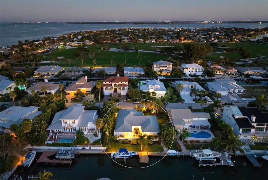 CANAL FRONT IN KEY ROYALE - NORTH POINT HARBOUR WITH COMMUNITY POOL AND TENNIS COURTS. Experience unparalleled luxury in this exquisite and elevated waterfront home. Beautifully remodeled with a NEW ROOF (2025) and turnkey furnished 3-bedroom, 2-bathroom waterfront home, offering nearly 2,000 square feet of luxurious living space and includes a community pool and tennis courts! The home sits at 11 feet elevation and had no flood damage. Located in the highly sought-after North Point Harbour community of Key Royale on Anna Maria Island, this home epitomizes an idyllic blend of elegance and tranquility. Having undergone tasteful renovations, this canal-front gem is fully furnished and move-in ready. It boasts 83 feet of waterfront with a private dock and a 12,000 lb boat lift, allowing you to embark on sunset cruises directly from your backyard into the open water with no bridges obstructing your path. The primary suite is a true retreat with a balcony overlooking the water, complete with a luxurious en-suite bathroom, walk-in closet. Additional bedrooms are generously sized and elegantly appointed. A lovely courtyard patio overlooking the water invites you to enjoy the outdoors and dine alfresco. North Point Harbour residents enjoy exclusive access to the community pool, tennis and pickleball courts, and clubhouse. Additionally, you have the option to join the private Key Royale Golf Club, featuring the island’s only golf course, along with dining and social activities. This home is just a golf cart ride away from Anna Maria Island’s stunning beaches and all its attractions, perfect for embracing the island lifestyle year-round or as a seasonal retreat. This home combines the best of luxury living with the beauty and serenity of a waterfront setting. The included pool drawings/renderings provide visions of a future pool. Don’t miss the opportunity to make this dream home yours.