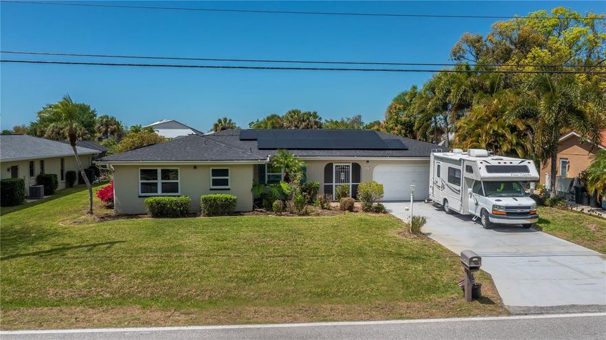 CHARMING CANAL-FRONT home in Port Charlotte area offering a flexible 2/3/2 split plan, a sparkling HEATED POOL so you can SWIM YEAR ROUND PLUS significant SOLAR SAVINGS. Wide water canal with MAGNIFICENT PANORAMIC VIEWS opens wide to Niagara Lake, making this a perfect retreat for entertaining, nature watching and everyday living. The tastefully updated chef worthy wide galley kitchen gleams with a tile backsplash, granite countertops, updated cabinetry and a cozy fireplace anchors the spacious living space. Pocketing sliding doors connect indoor living to the pool area for seamless indoor-outdoor living, this is truly FLORIDA LIVING. Bring your water toys...BOAT,KAYAKS,FISHING POLES...there is a wonderful dock n place to enjoy the freshwater paradise anytime of day right from your own backyard!
Key features and highlights
* 2 bedrooms + 3rd flexible space (2/3/2 split); POOL BATH for easy outdoor access
*Chef worthy kitchen with quartz countertops, tile backsplash;  fireplace; tile throughout main living areas
* Full pool bath; pool heater installed 2 years ago; tiled pool deck
* Roof replaced in 2025; all hurricane windows for enhanced protection
* Wide canal with direct access to Niagara Lake
* Pocketing sliders to pool; great for entertaining
* Extra exterior storage attached; inside laundry with Samsung washer/dryer staying
* AC in place for 4 years; attached garage with extra shelving
* TVs stay for added convenience
* Master suite: darkening shades, dual vanities, spa-like shower, Jacuzzi tub
* Bedroom 2: private ,fan &  mirrored closet; middle bath features subway tile and a new vanity
* Mango trees and a welcoming, well-maintained yard
 Located minutes from dining, entertainment, pristine beaches, Sunseeker Resort, historic downtown Punta Gorda, I-75, and PG Airport. This home combines classic charm with modern updates and the practical savings of solar. It’s move-in ready and perfectly positioned for Florida canal-side living while keeping utility costs low. Contact us to schedule a private tour and explore the lifestyle this property offers.