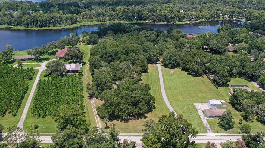 Discover Your Dream Lakefront Property in Lutz! Welcome to an absolutely pristine 6+ acre lakefront lot in the heart of Lutz. This exceptional property boasts nearly 500 feet of frontage on beautiful Lake Hanna, making it one of the most desirable and rare vacant lots available in Hillsborough or Pasco Counties. Situated on the scenic middle-bend of the east side of Lake Hanna, this expansive lot offers unrivaled development opportunities. Conveniently located near Livingston, Hwy-41, SR-54, this property provides easy access to Tampa Prime Outlets and Downtown Tampa. Essential services, including hospitals, schools, and shopping centers, are less than 10 minutes away. Spanning from Hanna Road on the east to Lake Hanna on the west, the lot promises stunning sunset views over the serene cypress groves lining the west side of the lake. These natural, untouched groves provide an unobstructed backdrop of primitive Florida beauty, ensuring your peace and privacy. Zoned ASC-1, like all rural land in Lutz, this property allows for one home/acre. This zoning preserves the area’s highly desired rural ambiance, making it perfect for those seeking a tranquil, natural pace of life. The lot is ideal for equestrian enthusiasts, hobby farmers, car collectors, and luxury estate seekers. Alternatively, it can be transformed into a small neighborhood of luxury homes, with several enjoying direct lakefrontage and breathtaking lake views. The property benefits from direct access to Hanna Rd and is ready for essential utilities. Lake Hanna, a private 31-acre ski lake in Hillsborough County, is home to only 43 lots. This ensures a quiet, pristine environment even on the busiest summer days. The lake offers various recreational activities, including boating, fishing, and water skiing. This property is an excellent investment opportunity with its prime location and significant development potential. Lutz has shown consistent property value growth, making it a wise choice for both developers and private buyers. Don't miss this unparalleled opportunity to own a slice of paradise on Lake Hanna. Embrace the natural beauty, tranquility, and limitless potential this extraordinary property offers.