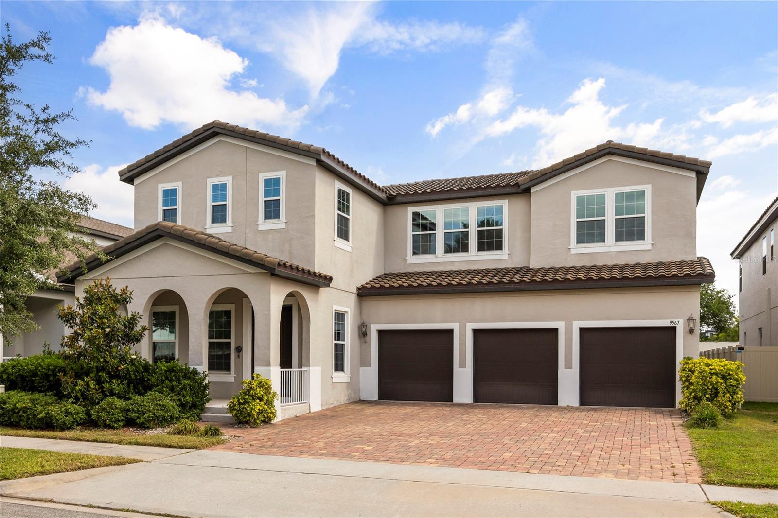 Move-in ready on September 1st.
Welcome to this beautifully upgraded 5-bedroom, 5-bathroom floorplan, where comfort meets style in the highly sought-after Watermark community. One of the bedrooms has been thoughtfully converted into a spacious media room by the original owners in 2019, but it can easily function as a fifth bedroom if needed. From the charming front porch to the shining luxury tile floors, this home is filled with elegant touches throughout. As you step inside, you’re greeted by a custom full-length glass wall in the hallway, adding depth and openness to the floorplan. The first room on the left is an office. Adjacent is a sophisticated formal dining room with stylish wallpaper. The soaring ceilings and oversized family room are designed for both entertaining and everyday comfort, featuring stunning window treatments, and a built-in surround sound system—perfect for cinematic nights at home. The gourmet kitchen is a chef’s dream, featuring stainless steel appliances, a large quartz countertop, a summer kitchen layout, and designer pendant lights, all of which can remain with the home. The first-floor master suite is a true retreat with blackout window treatments, a spa-like bath with a soaking tub, and a generous walk-in closet. Upstairs, you’ll find three additional bedrooms, a spacious loft, a study/den, and a one-of-a-kind themed game room with a hand-painted moon mural, cloud accents, twinkling ceiling lights, and a second surround sound system. While character decals will be removed, the immersive ambiance remains for endless family fun. Step outside to a covered patio with a heat-block screen and ambient ceiling lighting—ideal for evening gatherings. Located just a short walk from the luxury clubhouse and nearby commercial plaza, you’ll enjoy resort-style amenities including pool, a fitness center, fire pit, waterslides, tennis and basketball courts—all with a low HOA. This home offers the perfect combination of luxury, convenience, and community living. Please call for showing.