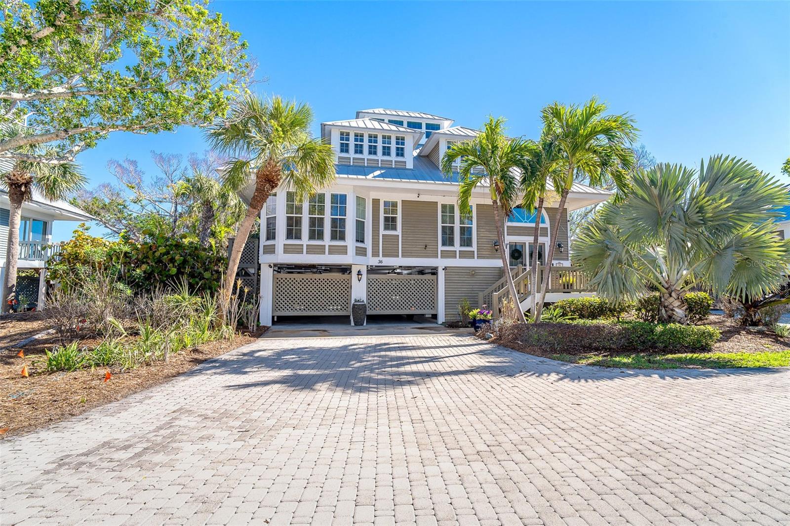 Charming Seawatch Home – Beachside Living on Boca Grande
Experience the ultimate in island living with this beautiful 3-bedroom, 3-bathroom home in the exclusive gated community of Seawatch on Boca Grande. Nestled along 1,000 feet of secluded Gulf-front beach, Seawatch offers two pools, three tennis courts, and lush tropical landscaping, creating a true coastal retreat just minutes from the village of Boca Grande.
Designed for both comfort and elegance, this home features an open floor plan with cathedral ceilings, filling the space with natural light and offering breathtaking water views from nearly every room. The spacious master suite is a private sanctuary, complete with a private balcony overlooking the water, two walk-in closets, a luxurious bath with a separate tub and shower, and a private water closet. Two well-appointed guest bedrooms provide comfort for family and visitors, including one with its own ensuite bath, ensuring privacy and convenience for guests.
This home is thoughtfully updated with a durable standing seam metal roof, an ultraviolet (UAV) light system in the AC unit for improved air quality, and upgraded electrical with a whole-home surge protector for peace of mind. A whole-house water treatment system ensures fresh, clean water throughout.
For those who love to take in the views, the top-level Seawatch offers a serene space to enjoy morning coffee with sunrise views or breathtaking Gulf sunsets. A cozy loft area provides the perfect setting for a home office, reading nook, or quiet retreat, all while embracing the beauty of the surrounding landscape. The screened lanai is an inviting outdoor space to relax while taking in the peaceful water views and gentle island breezes.
Practicality meets luxury with a lower-level garage and workshop, offering plenty of space for cars, golf carts, and all your beach toys. Located just minutes from dining, shopping, biking, and walking paths, you can easily explore the charm of Boca Grande, whether by foot, bike, or golf cart.
Don't miss this rare opportunity to own a piece of paradise in one of Boca Grande’s most sought-after communities. Call today to schedule your private tour!