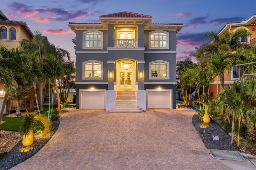 Under contract-accepting backup offers. SOON TO BE FEATURED ON HGTV'S 100 DAY DREAM HOME! RARE COVETED POINT LOT ON THE INTRACOASTAL WITH OPEN WATER VIEWS!!! This extraordinary ELEVATED estate is a sanctuary of style, technology, AND strength, offering the ultimate expression of refined waterfront living!  Every detail of this home has been meticulously reimagined- TONS OF RECENT RENOVATIONS including new interior and exterior paint, premium porcelain tile flooring, upgraded bathrooms, upgraded chef's kitchen, automated privacy sunshades, pavers, landscaping, and more.  With an unrivaled commitment to structural integrity, this residence is engineered to withstand the fiercest storms, built with insulated concrete construction, a tile roof, impact-rated windows, triple-lock doors, and a 2025 generator.Distinguishing features that elevate this home above the rest include a commercial-grade elevator servicing all levels, a full-home Control4 smart automation system, integrated stereo sound throughout, and the convenience of natural gas. Behind the front door lies a grand foyer that sets the tone for what’s to come: soaring ceilings and seamless flow between curated living spaces. The sophisticated office, formal dining room, and open-concept family room are bathed in natural light with stunning water views. The designer kitchen is a statement in itself—anchored by a dramatic, extra-thick quartz island and outfitted with top-tier appliances, ideal for culinary artistry and entertaining. Enjoy seamless indoor-outdoor living with balconies on both the front and back of the home—perfect for sunset dinners while watching the boats pass, or unwinding in complete tranquility—this is a setting like no other.Upstairs, retreat to your private primary suite—an opulent haven with its own gas fireplace,  private balcony offering uninterrupted water views, and spa-inspired bathroom featuring a soaking tub, resort-style shower, and exceptional walk-in closet system.  Spacious guest suites with en-suite bathrooms provide comfort and privacy. Outdoors, enjoy a newly resurfaced saltwater pool with brand-new pump and equipment, a putting green, and multiple spaces to unwind or entertain. The dock and boat lift have been professionally maintained and recently descaled, offering direct access to the Bay for effortless boating. A transferable flood insurance policy with premiums under $1,000 annually adds an extra layer of value and peace of mind. Located minutes from pristine beaches, bars, restaurants, and shopping, this property sits in a golf cart-friendly community—this is not just a residence, but a lifestyle. Don't miss out on your opportunity to own one of the most exceptional waterfront properties on the market today!