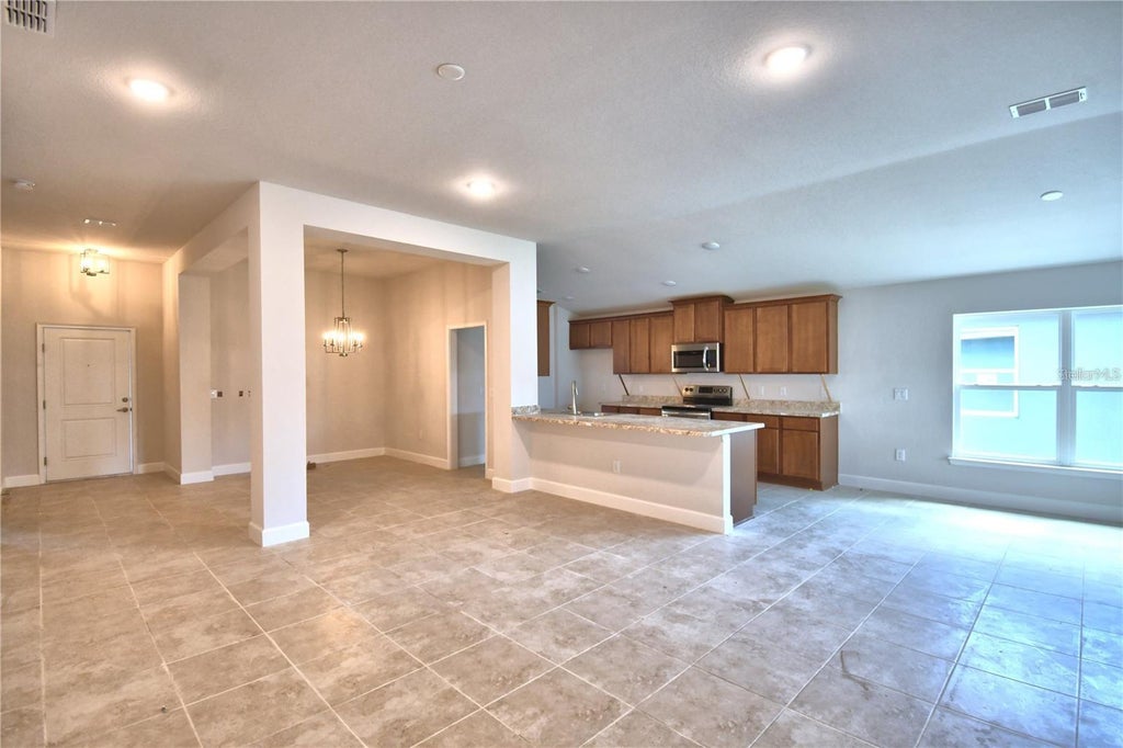 Photo of 910 Sofia Lane, Davenport, FL 33837 (MLS # O6449277)