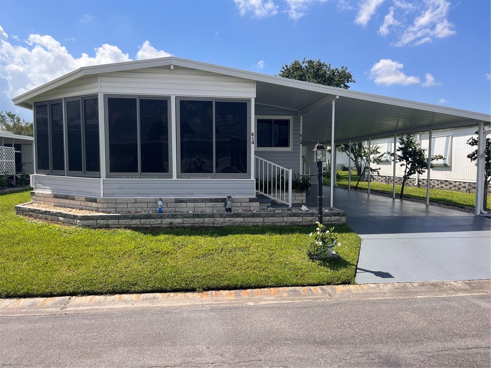 Very nice 2 bedroom/ 2 Bath double wide mobile home in an excellent community. Move in ready. Laminate flooring in the living room, dining room, Kitchen and the 2nd bedroom. Enclosed lanai had ceramic tile and a ceiling fan and an A/C unit. Master bedroom has carpet, plus a built in closet and a walk in closet and in suite bathroom with walk in shower. Kitchen comes fully equipped with lots of cabinets and counter space. The sink has windows above it for light and to be able to look out side to enjoy the day. The dining area has built in cabinets plus sliding glass doors looking out towards the carport and workshop/ and laundry room area. Washer/dryer and laundry sink. Westwinds is a great community with clubhouse, community pool and recreation facilities and activities to keep you as busy as you want to be. Close to restaurants', shopping and convenient to Bradenton and Sarasota. Check this home out, easy to view.