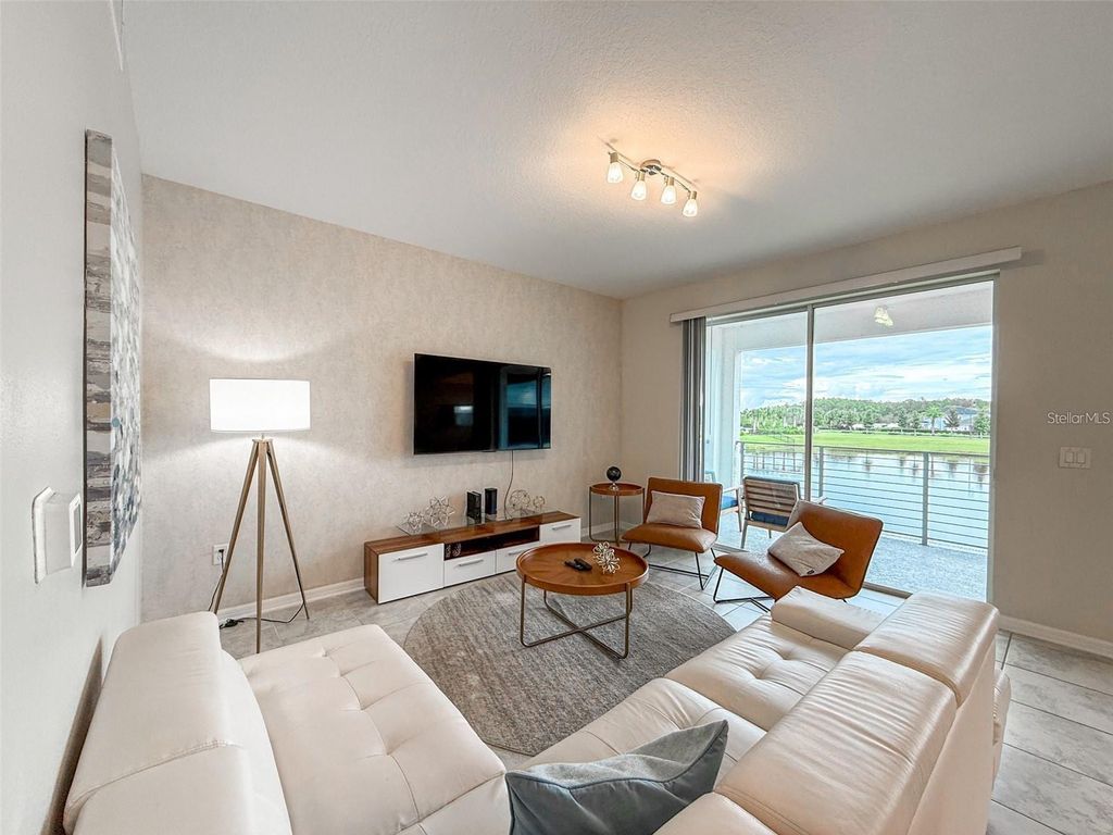 Photo of 3171 Paradox Circle #203, Kissimmee, FL 34746 (MLS # O6364556)