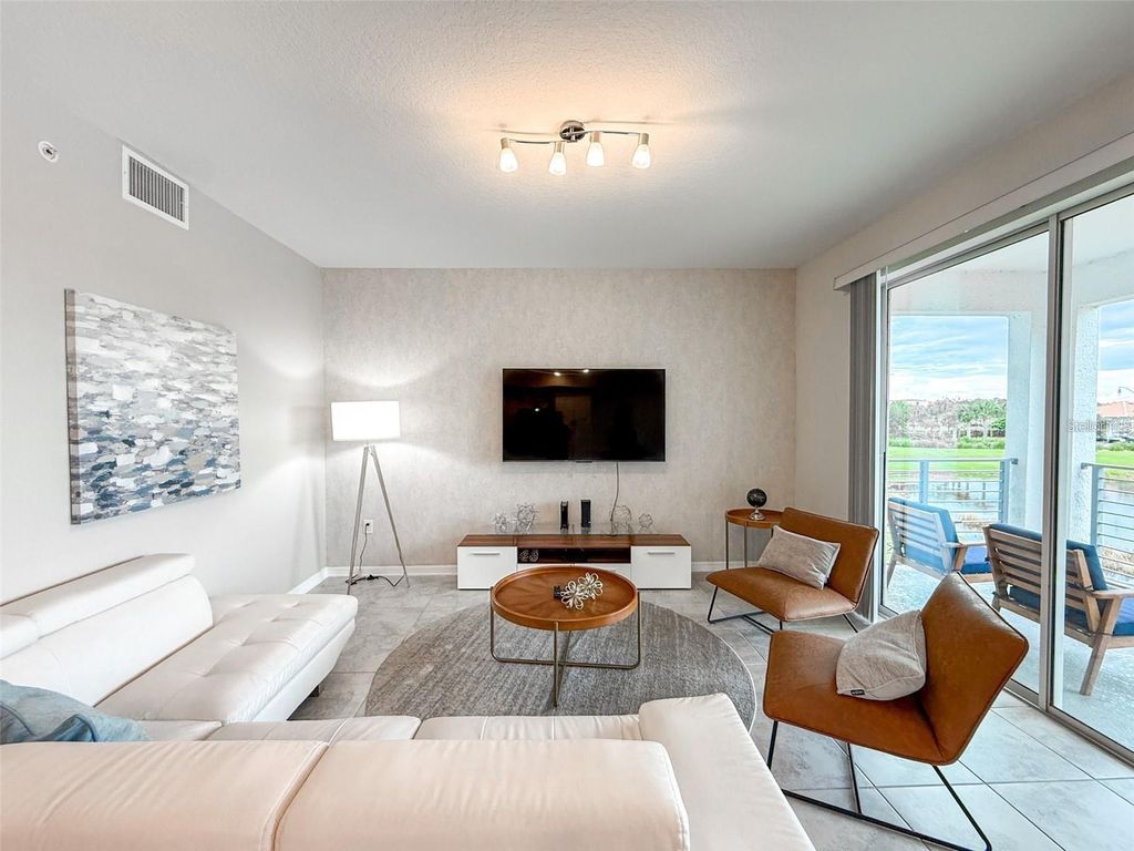 Photo of 3171 Paradox Circle #203, Kissimmee, FL 34746 (MLS # O6364556)