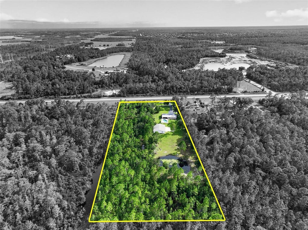 Photo of 20963 E Colonial Drive, Christmas, FL 32709 (MLS # O6449247)