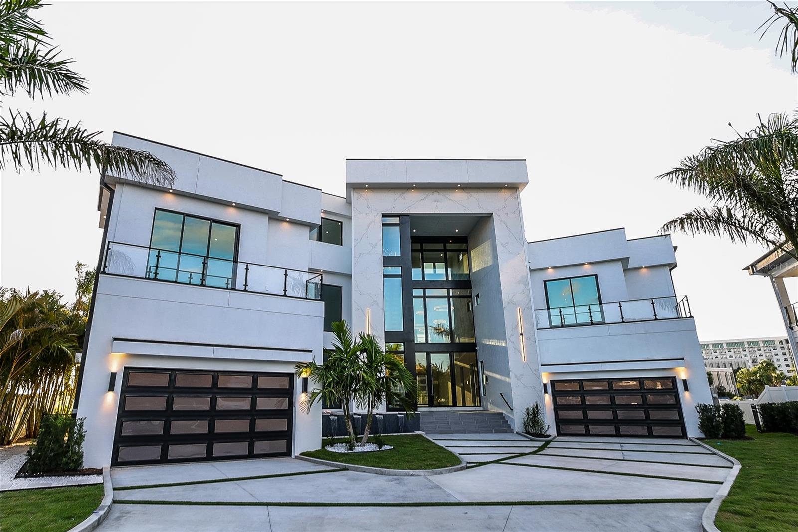 Tulia Home Designs new Contemporary construction offering open Bay Splendor in Beach Park. Built to exacting standards with state-of-the-art design, smart home technology, refined finishes and energy efficiency. Enjoy spectacular open Bay views with exceptional outdoor living and entertaining areas, custom pool and spa, outdoor kitchen, fire features, sun deck and open water access beyond. The home features 7 bedrooms, 8 and 1 half baths, plus Office, Media Room and Home Gym, Massage Room, game room and bonus room, along with a full wet bar and Wine Cellar. A custom Chef's kitchen boasts quartz counter tops, waterfall island, custom cabinetry, Wolf® gas appliances and walk-in pantry. Additional appointments include a 38-foot floating staircase, 8-car garage capacity (room for lifts), expansive terraces, Hardie exterior, with imported Italian porcelain tile, impact windows, elevator, Elan Smart Home System and custom closets throughout. Located in a top-rated school district and convenient to Westshore and International Malls, Tampa International Airport, shopping and dining. Floor Plans available.