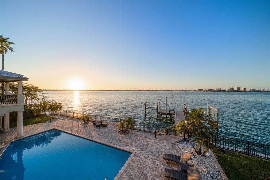 One or more photo(s) has been virtually staged. This Belleair Estate is an architectural masterpiece! With its stunning 140 feet of water frontage, it offers one of the best views in Pinellas County. Nestled on a oversized double lot, this rare to find waterfront home offers a unique blend of luxury and comfort, boasting breathtaking panoramic views of Sand Key, Belleair Beach, and the iconic Belleair Causeway. For the boating enthusiast, this property is nothing short of a dream come true. Imagine stepping onto your own composite dock equipped with a jet ski lift and both 25,000 lbs. and 9,000 lbs. boat lifts, complemented by a dedicated fish station—your gateway to endless adventures on Clearwater Beach and the Gulf. Spanning nearly 6,000 square feet, this residence features five generously sized bedrooms, six full bathrooms, an additional half bath, plus a study/office—perfect for accommodating family and guests alike. The first-floor game room opens to a large sparkling swimming pool that invites you to bask in the sun while enjoying the tranquil waters beyond. Ascend via the elevator to discover the expansive great room on the second floor where high ceilings and seamless window frames awe-inspiring intra-coastal vistas that will leave you breathless. The foyer welcomes you with a striking floating staircase adorned with exquisite light fixtures that enhance the home's traditional charm. Car & truck enthusiasts, an oversized 3-car garage plus additional space for recreational vehicles and/or supplies provides ample space for your storage needs. The brand-new tile roof (2025) complements its solid construction on pilings and grade beams with durable concrete flooring. With abundant storage options available throughout, clutter will never be an issue here. This property is truly one-of-a-kind—a rare opportunity not to be missed! Don’t let it slip away; schedule your private tour today and experience firsthand all that this magnificent waterfront paradise has to offer!