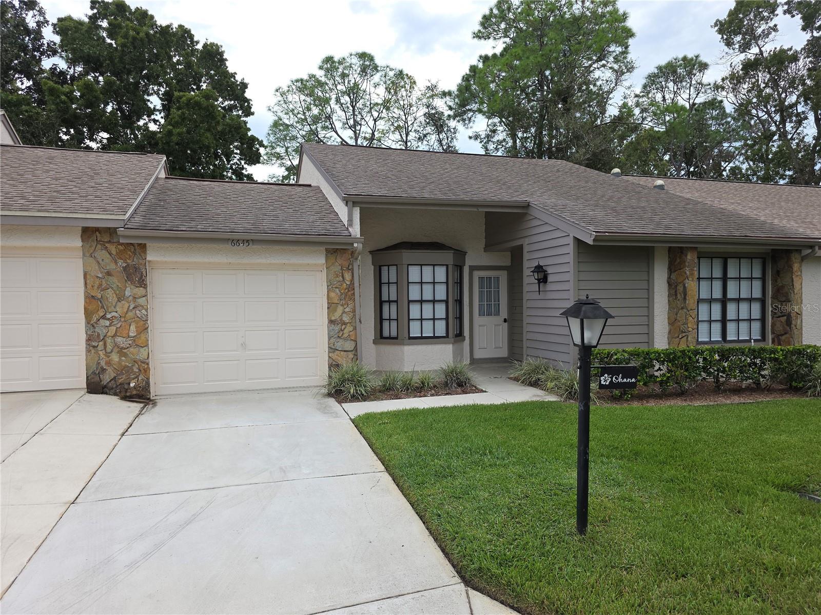 Timber Pines 2 Bedroom Villa 2 Full Bathrooms And A 1 Car Garage- This Home Has An Eat In Kitchen With A Pantry- Dining Room And A Living Room- The Primary Bedroom Has A Walk In Plus A Double Closet And A Tiled Walk In Shower- The 2nd. Bedroom Has A Large Double Closet Also- There Is A Vinyl Enclosed Porch And A Open Patio- Open Floor Plan Call Today For A Showing.- Timber Pines, a 55+ Gated Community, With 4 Golf Courses, Country Club, Remodeled Restaurant And Bar With Multiple TV Screens, 2 Pools, Fitness Center, Tennis And Pickle Ball Courts, Bocce Ball, Billiards Room And More Than 100 Different Clubs. Spectrum Cable, 2 boxes and High-Speed Internet Are Also Included In the HOA.