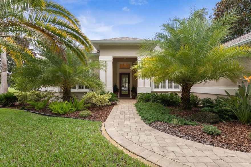 Welcome to this beautifully updated three bedroom, two bath home, 3 car tandem garage  with a breathtaking pond/lake view.  This home is located in the sought after Grand Havenn golf community.  Designed to impress, this residence offers modern upgrades and stylist finishes throughout.
Step inside the front door and you will find a light filled open floor plan.  A formal living room and dining room off the foyer with a large
gathering room.  The open floor plan features luxury vinyl flooring, a designer kitchen with beautiful blue cabinets and perfectly curated decor.  You feel like you have entered a model home but better.  The kitchen has stainless steel applicences, a walk in pantry, bar height counter tops and plenty of storage  The breakfast room has a wonderful view of the lake and access to the lanai.   The primary bedroom boosts a large walk in closet and a extra space for perhaps an office, exercise area or reading nook.   The other two bedrooms and guest bath are spacious.  The bathrooms and kitchen were recently remodeled, plantation shutters added, roof, water filtration system, painted garage floor, paver driveway and sidewalk and new screen for lanai.  
Enjoy peaceful evenings from your patio overlooking the serene lake, all while living in a secure, gated community known for its charm and amenities.  
This is more than a home.  I know you will fall in love with it the moment you step through the door.