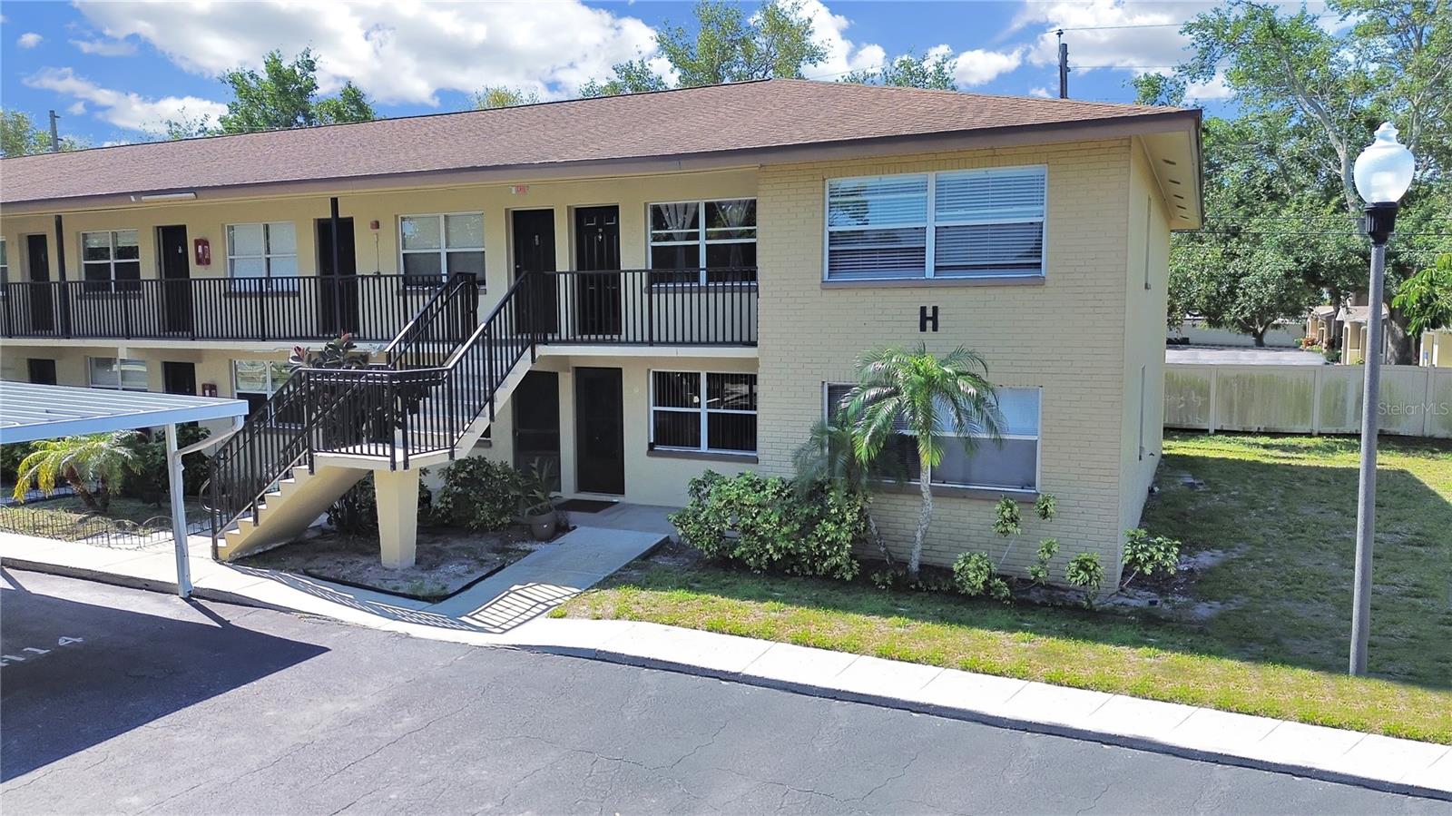Beautifully Renovated 1-Bedroom Condo with Reserved Parking – Move-In Ready! Discover this stunning second-floor condo perfectly located just steps from the scenic Pinellas Trail and the brand-new pedestrian bridge over US-19. Centrally situated for convenience, this charming unit is loaded with modern upgrades and stylish finishes. Step into a bright, freshly painted interior featuring real wood kitchen cabinets, sleek granite countertops, and stainless steel appliances. The new tankless water heater not only provides efficiency but also frees up valuable closet space. Enjoy peace of mind with a newer electrical panel and AC unit, plus a contemporary bathroom with a modern vanity and subway-tiled bathtub. The spacious bedroom boasts a large closet, while ceramic tile flooring throughout ensures easy maintenance and a clean, polished look. Whether you're a first-time buyer, downsizing, or looking for a great investment, this move-in ready condo is a must-see! Schedule your tour today!