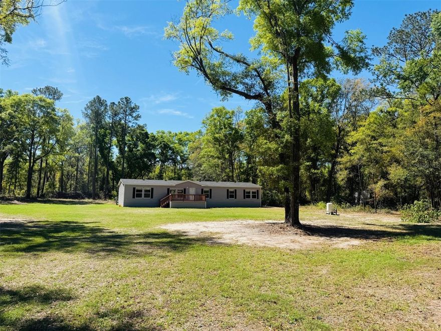 Never Lived in (New) 2022 Ironman Model on over an Acre! This 4Bed 2Bath( 2254 Sqft) features an open spacious floor plan with an Island kitchen. This HOME features a LRG Living room and Activity room* the 4 Bedrooms are very spacious along with His/her sinks* a Garden Tub and Separate Walk n Shower and Closet. This Home is on a paved road miles from Lake City and I 75.