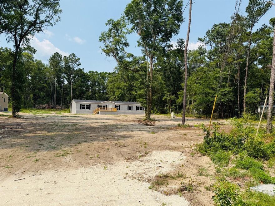 Never Lived in (New) 2022 Ironman Model on over an Acre! This 4Bed 2Bath( 2254 Sqft) features an open spacious floor plan with an Island kitchen. This HOME features a LRG Living room and Activity room* the 4 Bedrooms are very spacious along with His/her sinks* a Garden Tub and Separate Walk n Shower and Closet. This Home is on a paved road miles from Lake City and I 75.