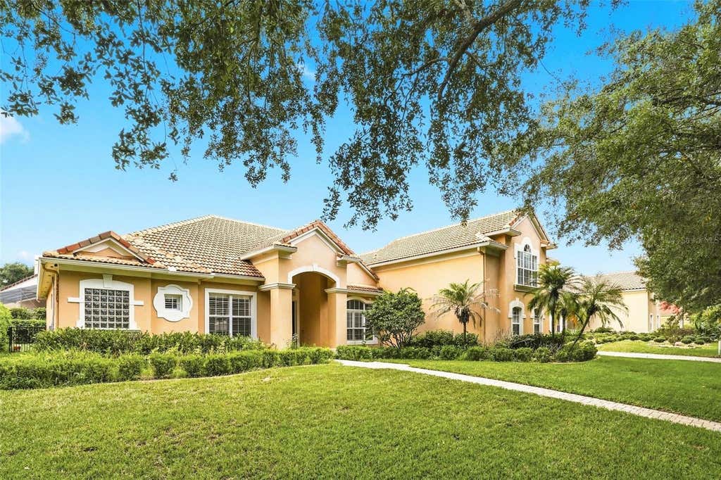 Photo of 7746 Debeaubien Drive, Orlando, FL 32835 (MLS # O6432920)