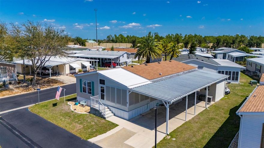 Beautiful 2-bedroom, 2-bath manufactured home with a den located in a desirable 55+ co-op community, offering comfort, space, and a peaceful lakefront setting. This well-maintained and fully furnished Cavalier home features a bright open floor plan with luxury vinyl flooring throughout, creating a modern and low-maintenance living space. The spacious kitchen is designed for both functionality and entertaining, featuring solid wood cabinetry, abundant counter space, a large center island, and a dedicated eat-in dining area perfect for casual meals or hosting guests.
The home offers generously sized bedrooms with ample closet space, providing comfort and storage. The additional den provides a flexible space that can easily be used as a home office, hobby room, or additional guest area. The large enclosed front porch is a standout feature of the home, offering beautiful lake views and non-slip pebble tech flooring, making it an ideal space to relax with your morning coffee or enjoy the Florida breeze.
Additional upgrades and features include double-pane windows with hurricane protection, a new roof installed in 2023, and a complete HVAC system replaced in 2018, providing peace of mind for years to come. A lanai added in 2017 offers even more outdoor living space to enjoy the Florida lifestyle.
The property also features a long covered two-car carport, providing plenty of parking, along with a convenient storage shed located underneath for tools, seasonal items, or extra storage. Located within a welcoming 55+ co-op community, residents enjoy a quiet and friendly neighborhood atmosphere while being close to shopping, dining, and local amenities.