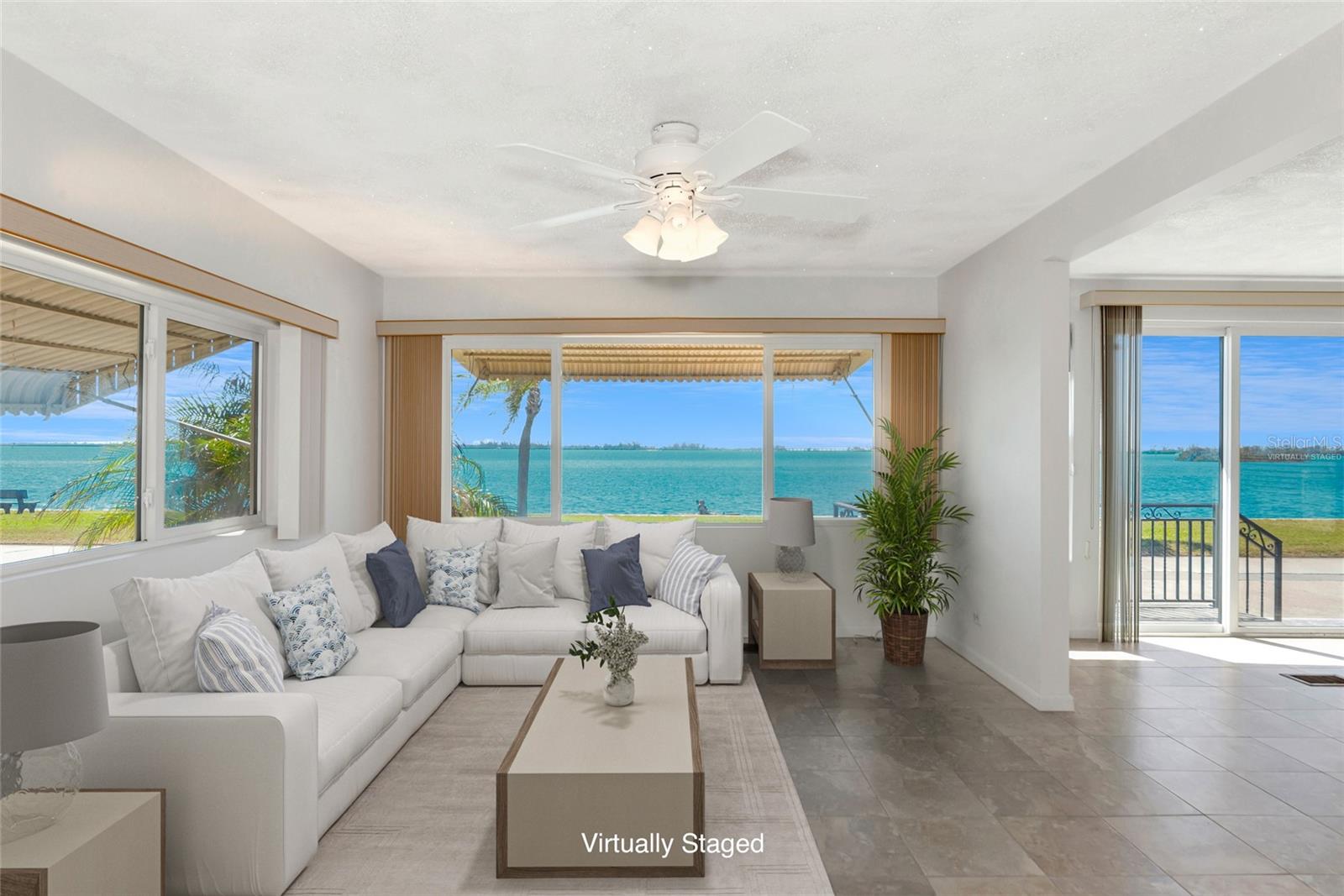 One or more photo(s) has been virtually staged. Welcome to Paradise Bay, located right on Sarasota Bay! A great value with amazing views, this 2br 2ba home comes packed with features including NEW HVAC (mini-split system June 2025), all new side skirt and insulation in the crawlspace, updated kitchen & bath, newer appliances, and HURRICANE IMPACT windows and sliders! This beautifully updated mobile home offers the perfect blend of comfort, style, and convenience. Enjoy direct, breathtaking water views of Sarasota Bay from the comfort of your own home, and experience the serenity and natural beauty of endless sunsets and living just moments from the beach. PRIVATE DOCK & boat slips are just steps away and available for purchase--take the boat out and play all day. Other features to mention: Gas range for cooking, both bathrooms are updated with walk-in showers, and both bedrooms have spacious walk-in closets for clothes or storage. Whether you're relaxing inside or entertaining guests, the inviting living spaces make it easy to feel at home. The low HOA fee of just $180 per month makes this an affordable option for anyone seeking a relaxed and fulfilling lifestyle, while offering access to all the amenities this wonderful community provides. Don't miss your chance to own this exceptional mobile home with stunning water views in a sought-after 55+ community. Schedule a tour today and make this paradise your own!