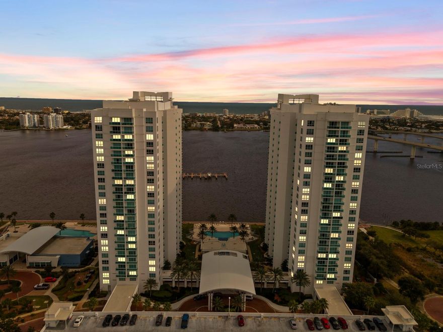 SELLER FINANCING AVAILABLE — a rare opportunity in one of Daytona’s premier waterfront luxury communities.
Experience resort-style living in this 7th-floor 2BR/2BA condo offering 1,670 sq ft of modern living space and breathtaking WATER VIEWS of the Intracoastal from your private balcony. This spacious residence features 9-foot ceilings, floor-to-ceiling windows, an open-concept layout, and a gourmet kitchen equipped with stainless steel appliances, granite countertops, and ample cabinetry. In-unit laundry adds to the daily convenience.
The primary suite includes direct balcony access, serene water views, and a spa-inspired ensuite bathroom. This unit also offers a rare, first-floor assigned parking space for added convenience.
Marina Grande on the Halifax is a sought-after luxury community featuring two waterfront resort-style pools, a state-of-the-art fitness center, steam room and sauna, clubhouse, billiard room, party room, and a private 12-seat movie theatre. HOA fees include water, cable, internet, building insurance, two secured parking spots, gated security, and 7-day concierge services.
This waterfront condo delivers comfort, convenience, and exceptional amenities. Take advantage of seller financing and make this stunning condo yours today.