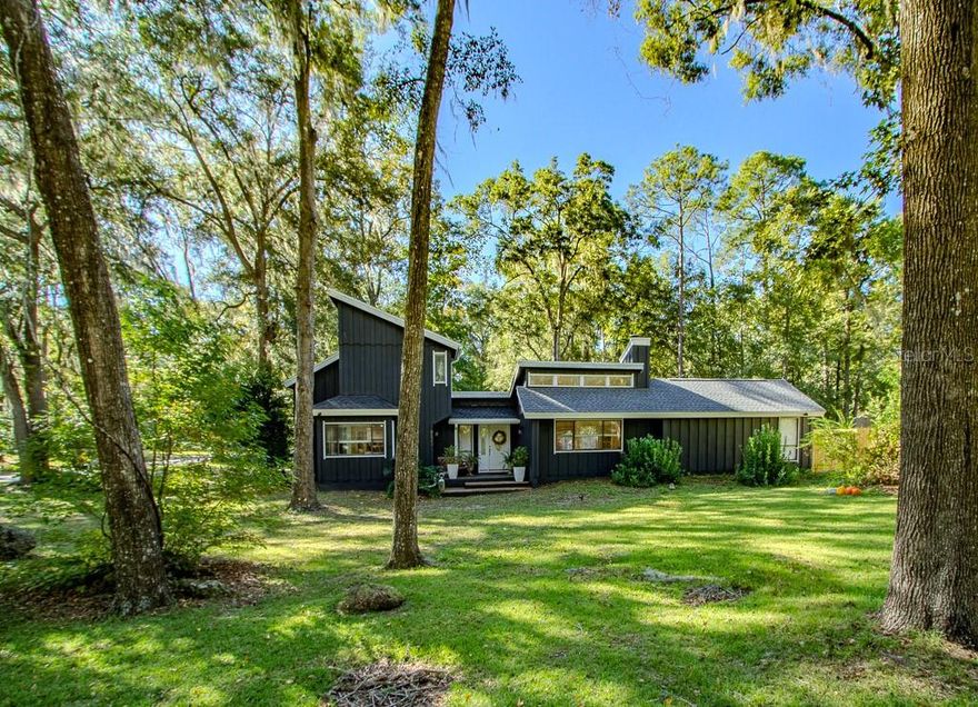 Welcome to this charming 4 BR/3BA pool home in Buckingham South (no HOA). Nestled on nearly a half-acre corner lot, featuring 2,444 sq ft of living space with NO CARPET.  Step inside to an open floor plan that unites the living, dining and kitchen into one flowing, light-filled space.  Every first-floor room opens to the pool, decks, patio and spacious fenced backyard.   Perfect for entertaining or simply relaxing in your own retreat.  The family room features cathedral ceilings, wet bar and a wood burning fireplace. The split-bedroom plan includes a spacious primary with en suite bathroom, granite countertop and walk-in closet.  On the opposite side is an in-law suite/guest bedroom with Jack and Jill bathroom and a private entrance.  The kitchen includes granite countertops, window solarium for plant or herbs.  A lower nook with windows for your pet’s enjoyment or a play area.  Upstairs, two more bedrooms and a full bath with granite countertop and a jetted tub.  Each upstairs bedroom includes built-in desk space, and one bedroom has a bay window seat.  There is a mud room/utility room at side entrance. Pool was resurfaced in 2025, and roofs were replaced in 2023 and 2025.  Enjoy quiet living, convenient to shopping, dining and schools.