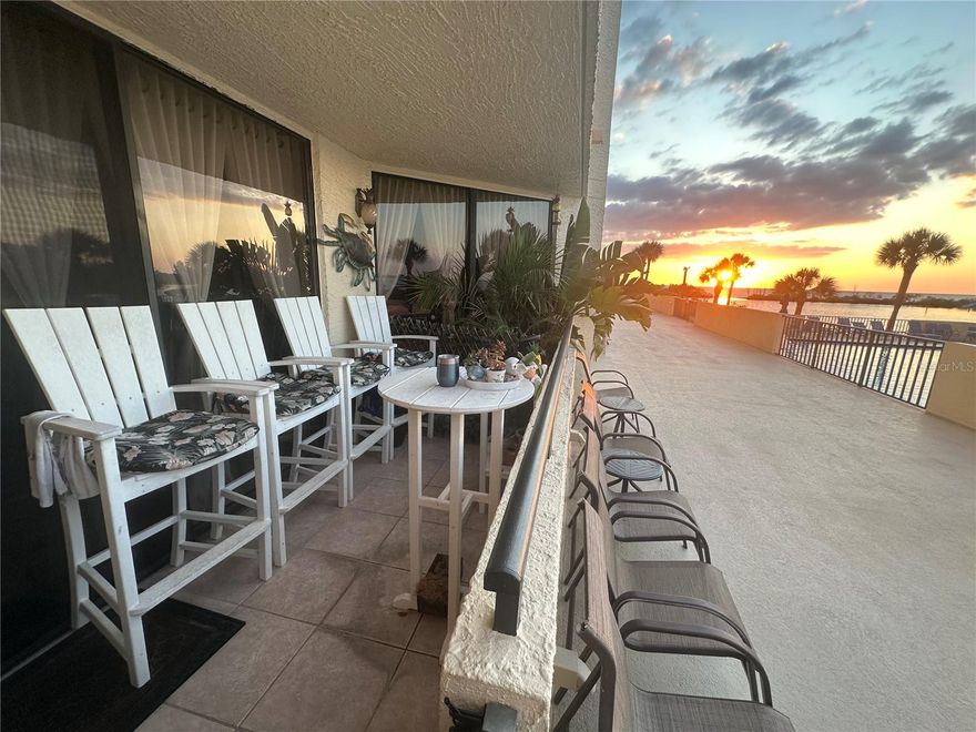 Unique and Charming blend of vintage and beachside decor greet you upon entering this upgraded poolside condominium. Charming embossed ceiling tiles and chandelier lighting throughout takes you back in time. Mariner and beachy decor reminds you that you are living in a Nature's Paradise Gulf side resort style community. The condo boast upgraded kitchen with stainless appliances and breakfast bar. Relax in the inviting master suite with 4 posted covered bed or custom step in shower with rain head fixture. Unwind in the comfy Living room recliners watching your favorite TV show. Second bedroom also has an ensuite bath and custom double closets. Condo comes with inside washer and dryer and assigned parking space in the parking garage which a lot of the other units for rent do not have. The first floor lanai offers easy access to the Olympic sized heated swimming pool ,walking or sunbathing along the promenade, or even additional area for large family gatherings.  Watch the dolphins play, the manatee float , and the water fowl fly by from  the private sandy beach or in the Olympic size heated pool alongside the picturesque lagoon. This island is completely surrounded by water except for the 24/7 guarded entry for your upmost security. Fishing & kayaking are at your doorstep along with tennis & pickleball courts & clubhouse with full fitness center, game rooms, and function area. Participate in the many community events. Rental includes all utilities except electricity. Community ideally located close to multiple beaches, restaurants, shops ,golf courses, to the Sun West Water Park and to all that the Tampa Bay and the St.Pete / Clearwater areas have to offer day or night. View the community tour to fly over or walk around the community. Call today for a private in person viewing and Enjoy Life.! Don't you Deserve it! Rental rates vary depending on time of the year and length of stay. Currently being offered for at least a one year term. Call for more details.