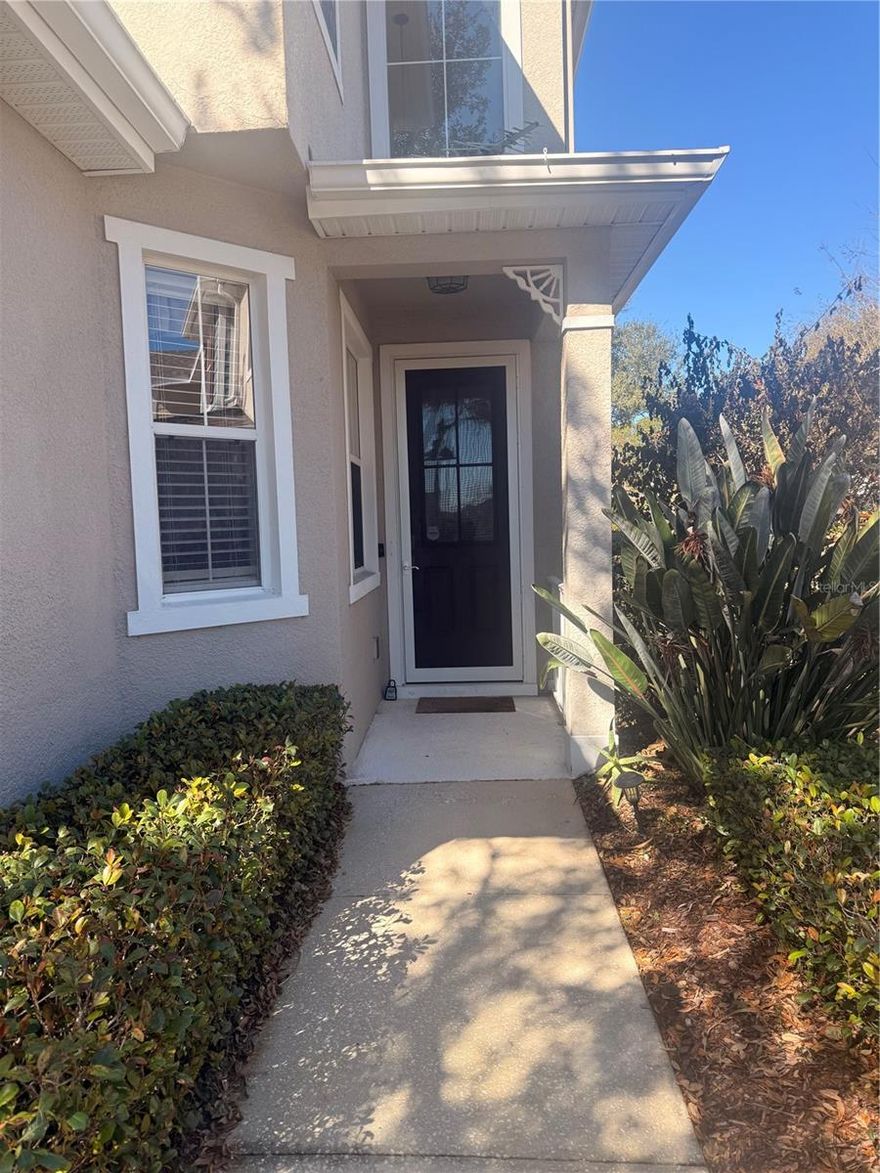 Discover this expansive townhome featuring four bedrooms and three and a half bathrooms, thoughtfully designed for comfort and versatility. This residence boasts two primary suites; one situated on the main level and another upstairs, offering exceptional convenience and privacy. Ideally positioned just minutes from the vibrant Downtown Mount Dora, the townhome showcases a harmonious blend of carpet, laminate, and tile flooring throughout, complemented by an open floor plan flooded with natural light and soaring volume ceilings.  Enjoy easy access to community amenities including a pool, clubhouse, and fitness center, all within a short stroll. Ample guest parking is available to accommodate visitors with ease. The upstairs loft presents a versatile space, ideal as a playroom or a fantastic home office. Exterior upkeep is effortlessly managed by the homeowners association, which covers lawn care, exterior maintenance, roof repairs, and all shared amenities. Brand new HVAC replaced by Frank Gay in August of 2024 and Handler December 2025.  The HOA is responsible for the exterior of the property, including ther roof which was just replaced on May 2025.  Schedule your private tour today to experience this exceptional property firsthand.