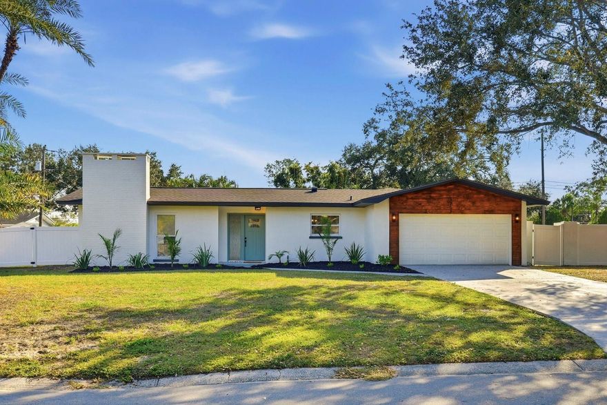 Beautifully Updated Sanctuary! Stunning 3 Bedroom, 2 Bath Pool Home in a Prime Location.  Welcome to this move-in ready oasis featuring a brand-new roof, new LVP flooring, and fresh interior and exterior paint. Enjoy peace of mind with numerous updates including new systems, new windows and doors, and a new garage door with opener. The sparkling pool has been beautifully refinished, and the screened enclosure has been updated, creating the perfect space for outdoor relaxation and entertaining.  The home boasts a thoughtfully updated kitchen and baths. The custom kitchen showcases modern shaker cabinets, quartz countertops, and all-new stainless-steel appliances, ideal for both everyday cooking and hosting.  Located in a highly desirable area, this home offers unbeatable convenience with close proximity to gorgeous Gulf beaches, major highways, shopping, dining, airports, and a variety of popular local attractions. Experience the perfect blend of comfort, style, and location—your Florida lifestyle awaits!