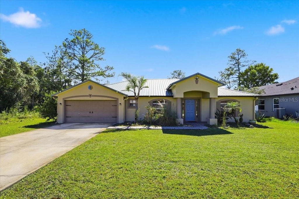 Photo of 92 Robinson Drive, Palm Coast, FL 32164 (MLS # FC322181)