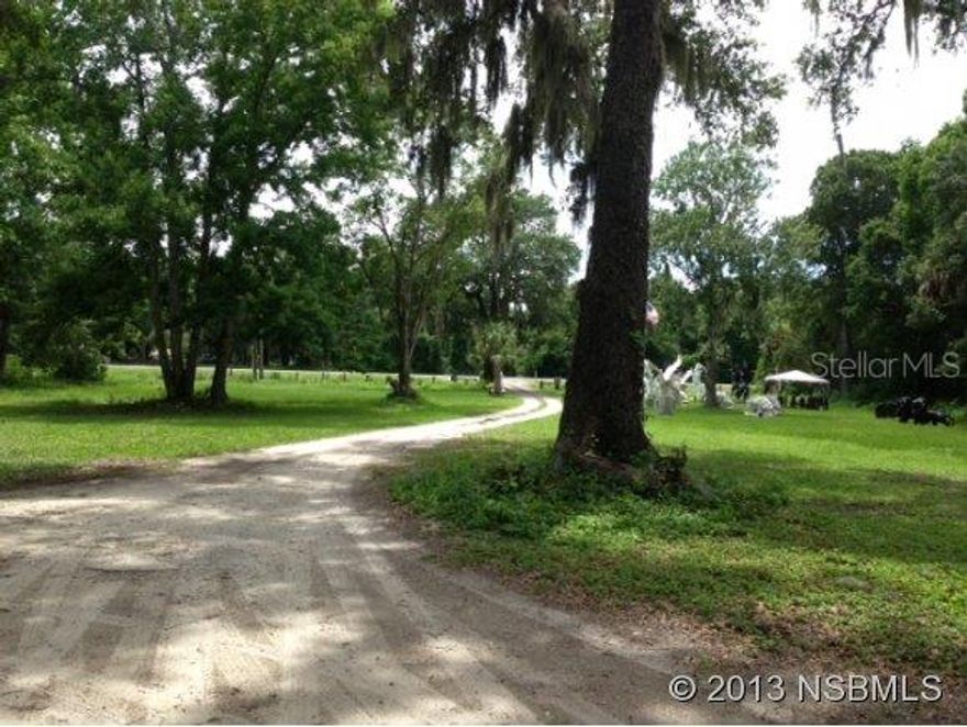 Building is original mobile home that has been built around. Previously used as a residence but could be converted to commercial use.  The sale also includes the adjoining tax ID #9508-02-00-0070.  Property has lovely pond and lots of wildlife.