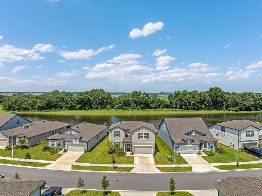 Experience luxury lakefront living with this exceptional 5-bedroom, 3-bathroom home in the desirable Epperson community. Boasting 2,800 sq ft of beautifully designed space, this residence offers unparalleled comfort and style. Enjoy the convenience of a first-floor master suite with a large walk-in closet, plus four additional bedrooms with ample closet space. The home features high-end finishes, including Luxury Vinyl flooring throughout the main living areas, Quartz countertops, and 42-inch cabinets with crown molding. Relax or entertain in the open loft area and take advantage of the screened-in lanai, perfect for outdoor gatherings or serene evenings overlooking the lake. Includes a 2-car garage. For added convenience and fun, a 6-passenger golf cart is available for rent to explore the neighborhood or transport you to the lagoon. Epperson Community Perks: At Epperson, every day feels like a vacation. Dive into the crystal-clear blue waters, unwind at the swim-up bar, or challenge friends to a game of beach volleyball. With amenities like a 30-foot water slide, floating obstacle course, kayaks, and paddle boards, there's always an adventure waiting for you. Make this lakefront paradise your new home! Property does include High speed internet, Spectrum cable and Lawn Maintenance.