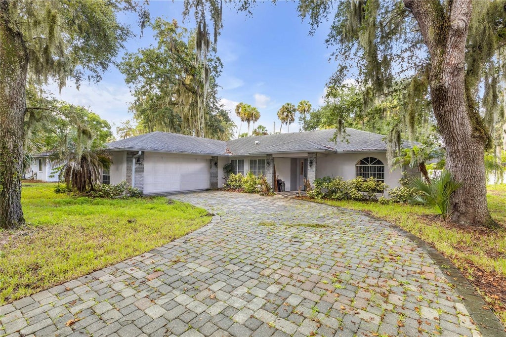 Photo of 1328 Needle Palm Drive, Edgewater, FL 32132 (MLS # O6444682)