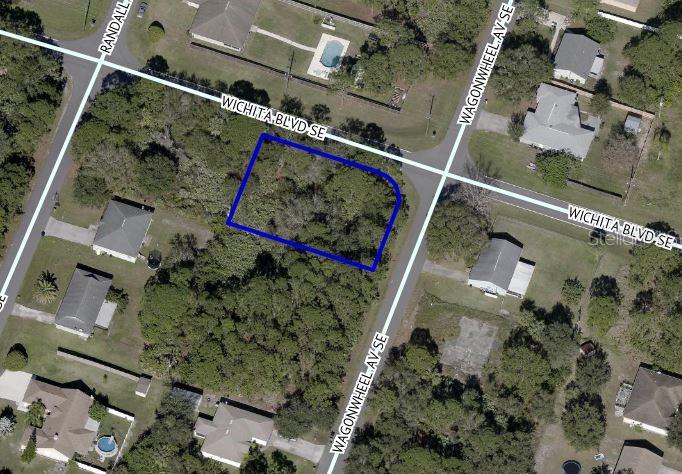 Corner lot !! Great buildable lot in the Port Malabar unit 18 area. This SE neighborhood just a few blocks off of San Filippo is quiet and is full of nice homes. Come take a look and get started on your dream home.; Cleared: Partial
