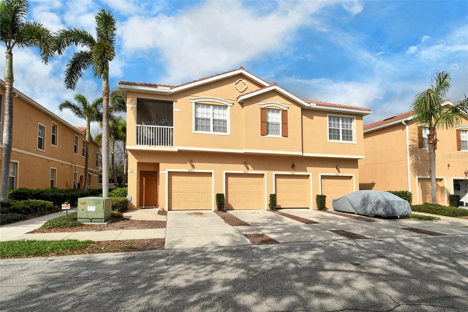 Experience unparalleled convenience in the heart of the University Parkway Corridor. This charming ground-level condo boasts a private garage with direct access to your new home—no stairs to worry about. Step inside to find a spacious great room and dining area, open to the kitchen, perfect for both everyday living and entertaining. Relax and unwind on your private lanai, just off the living room, where you can enjoy the outdoors or step out to a grassed area. The thoughtful split-bedroom layout ensures privacy. The owner modified the third bedroom into a quiet office/den, bringing more natural light into the main living area. Easy to reinstate as 3rd bedroom if desired. With a brand-new water heater and garage door opener, everything is ready for you to move in and enjoy. Nestled in a peaceful corner of the development, you'll appreciate the immediate access to the surrounding area through the side gate. Parkridge is a gated, pet friendly community with a beautiful heated pool at its core. Just a short walk to Detwiler’s Farm Market, plus an array of stores and restaurants. Convenience truly surrounds you. Quick access to UTC Mall, Benderson Park, Downtown Sarasota, and I-75—everything you need is within reach!